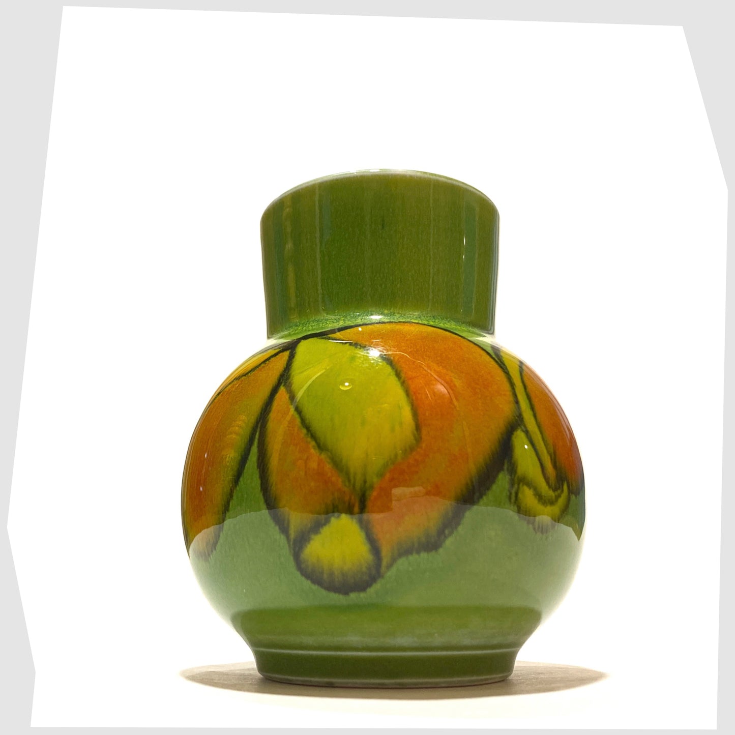 small poole pottery vase, shape 31 by Julia Wills, finished in a green delphis glaze with yellow and orange forms