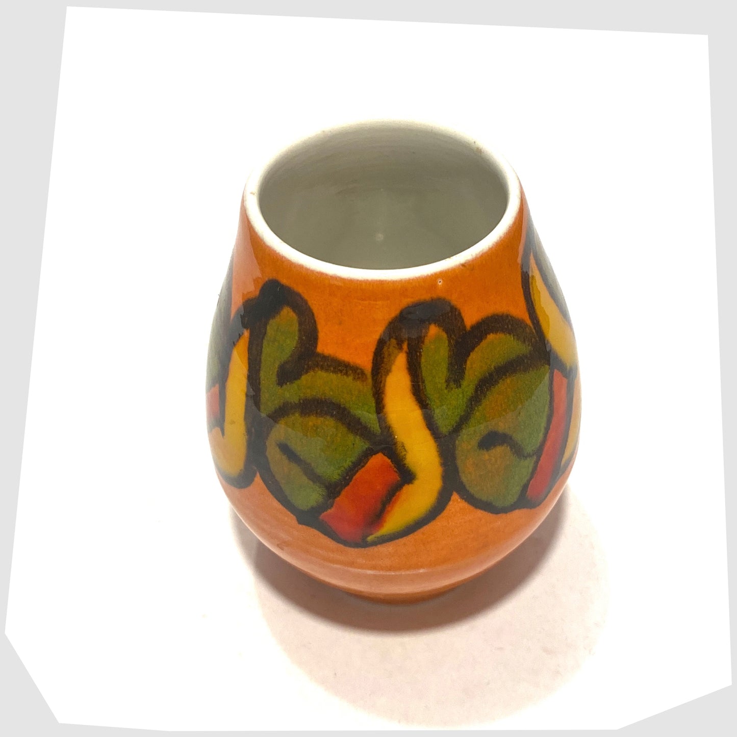 top rim of the Poole Pottery Shape 31 Vase by Cynthia Bennett finished in an Orange Delphis glaze with forms of green, yellow and red