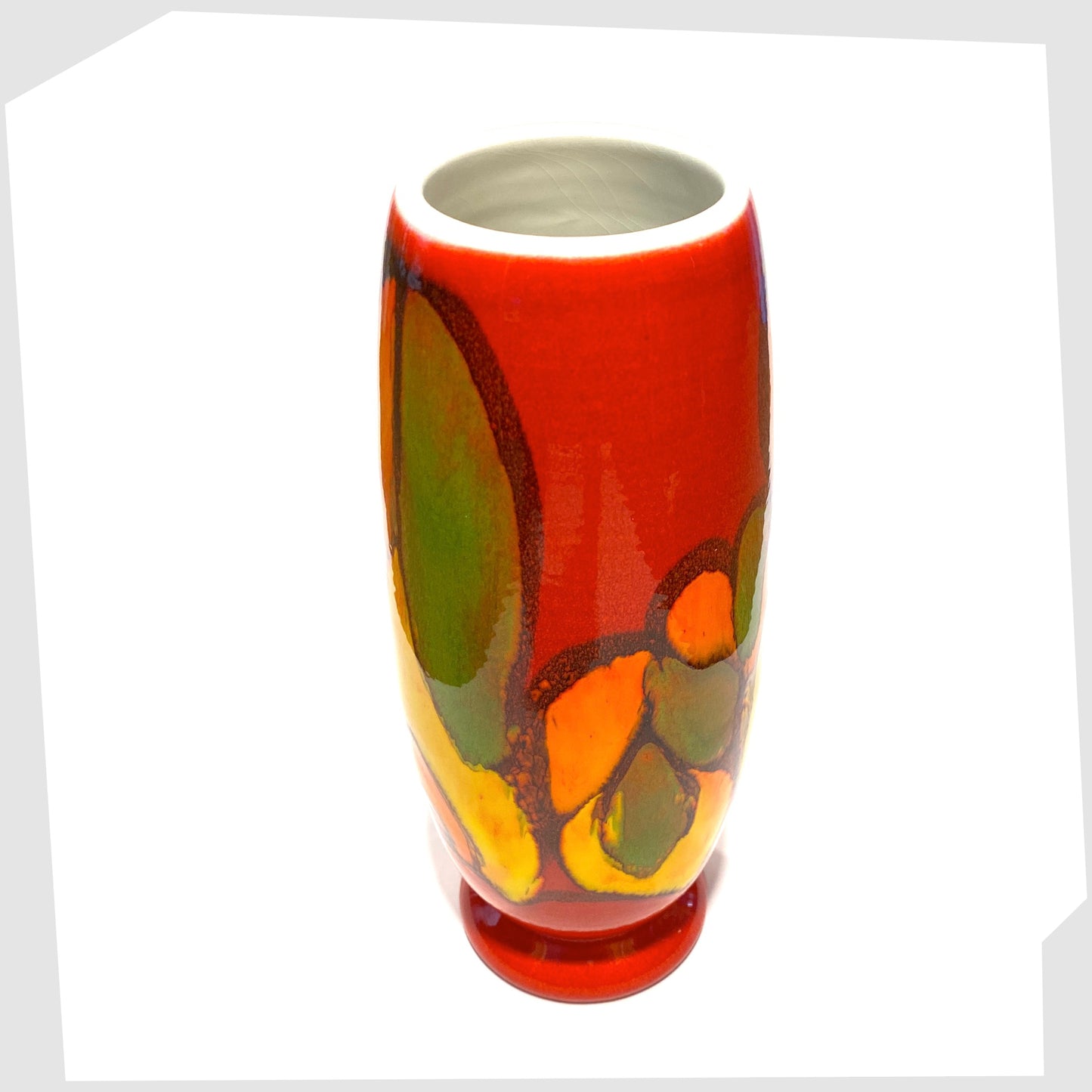 top rim and white inner glaze of the poole pottery delphis vase, shape 15, glazed in a vivid red with flowing forms of yellow, green and orange