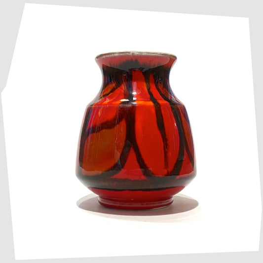 Poole Pottery Delphis Vase, Shape 31, by Lynn Gregory finished in a red glaze with fluid forms of green and orange