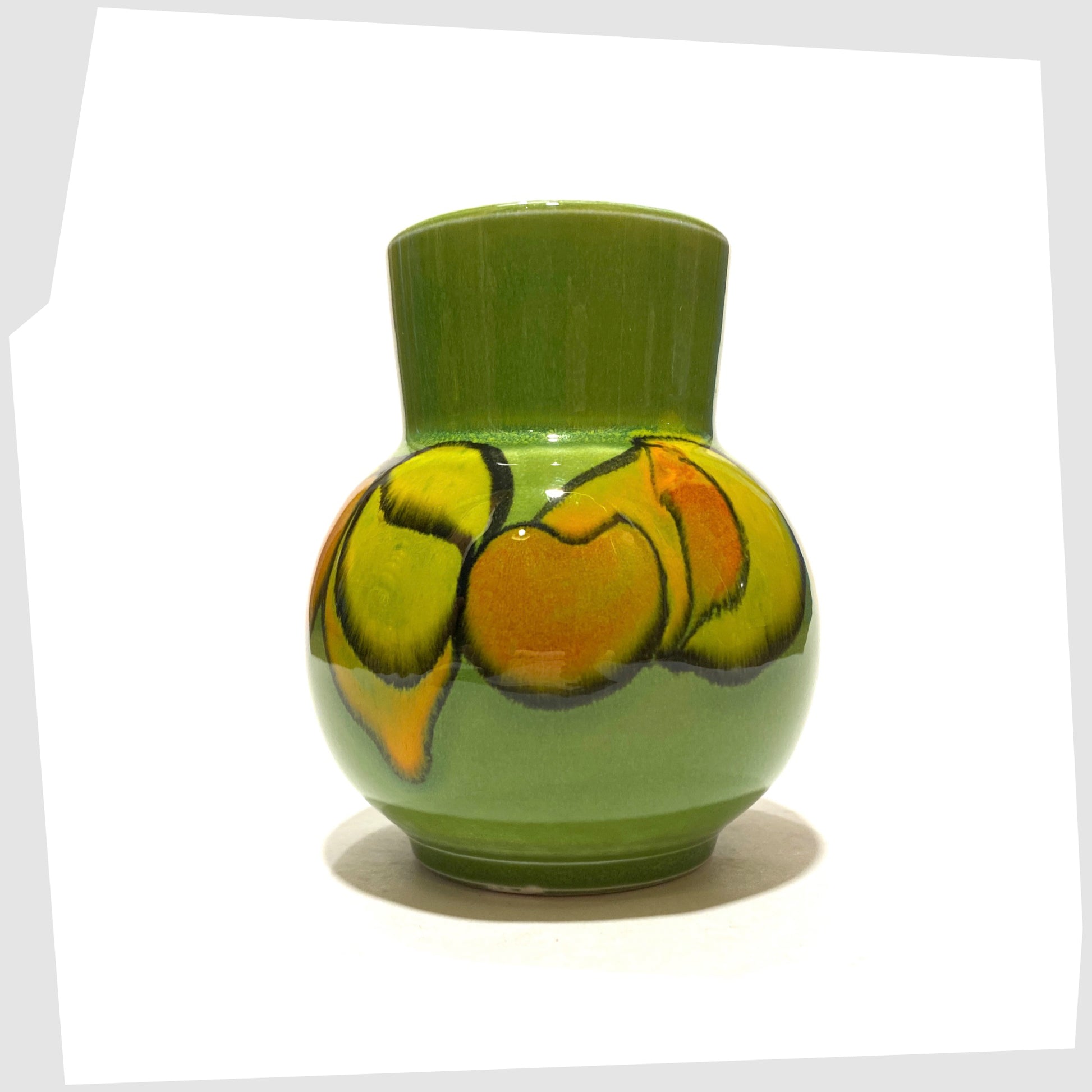 vintage poole pottery vase, shape 31 by Julia Wills, finished in a green delphis glaze with yellow and orange forms