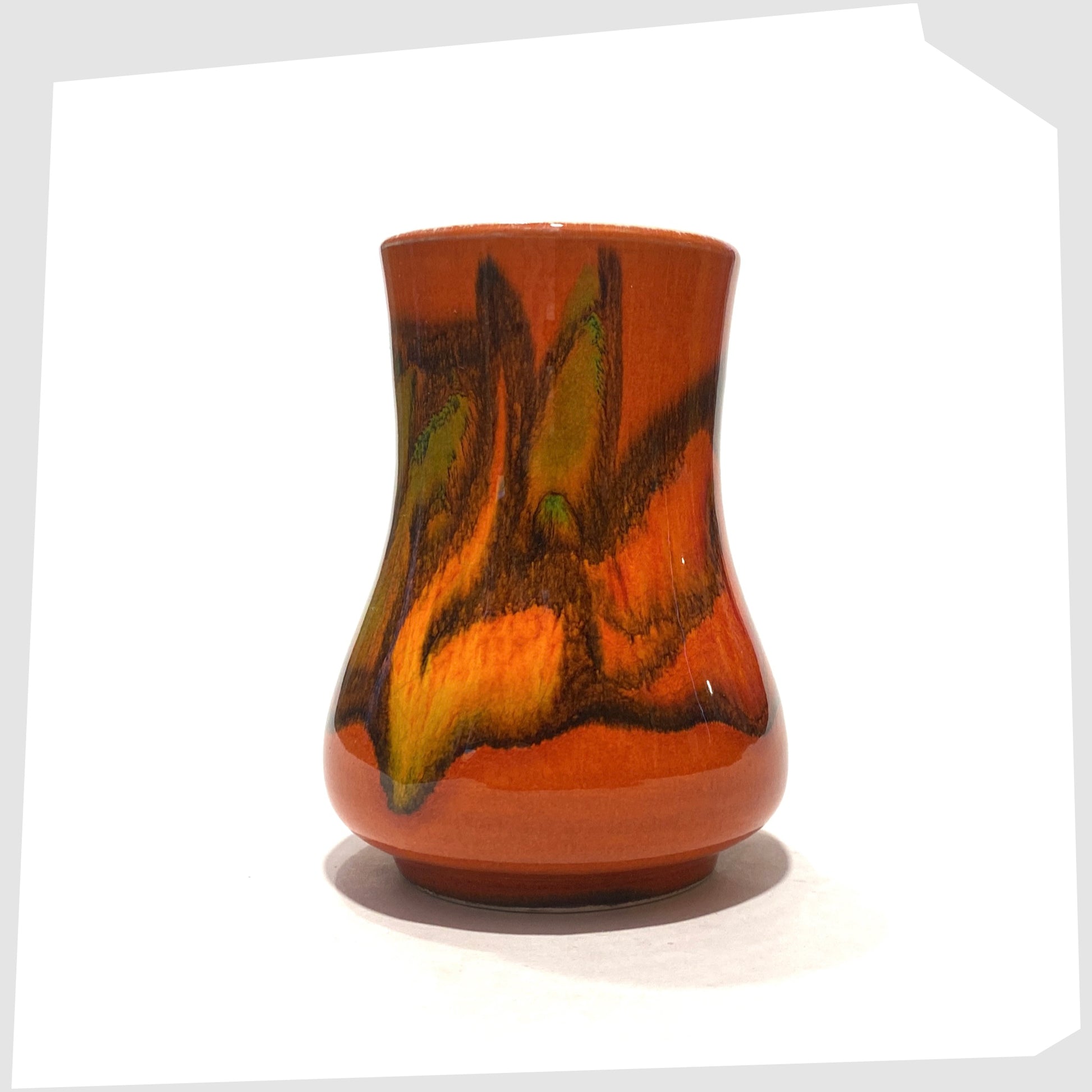 1970s Small Poole Pottery Delphis Vase, Shape 31, by Tina Fancy- glazed in a rich burnt orange with fluid forms of yellow, green and red, shown on a white background
