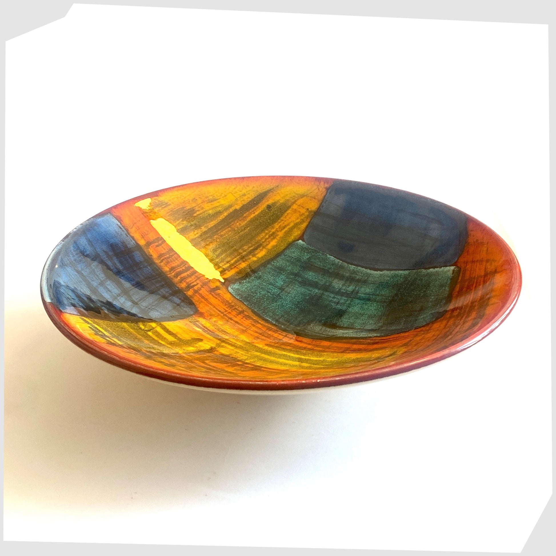 poole pottery dish glazed in the gemstones pattern of orange, red, blue and green