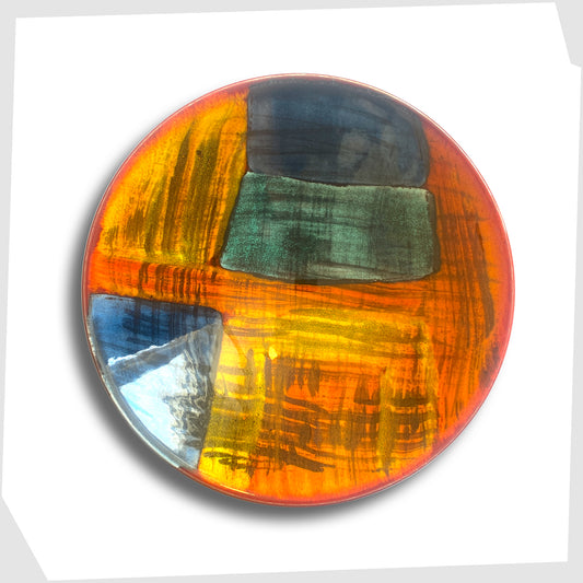 poole pottery gemstone dish glazed in an artistic pattern of orange, red, blue and green