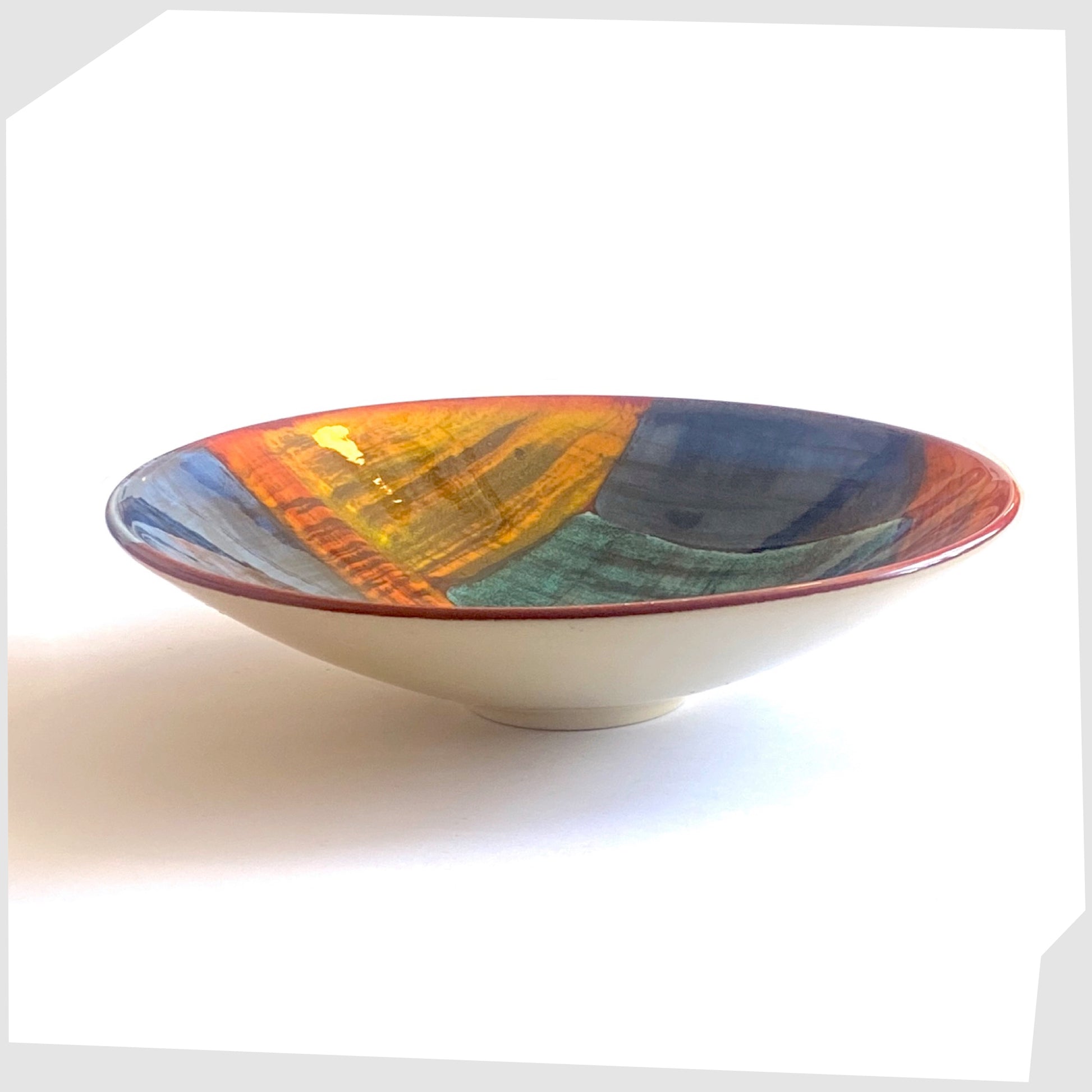 poole pottery gemstones dish glazed in an artistic pattern of orange, red, blue and green