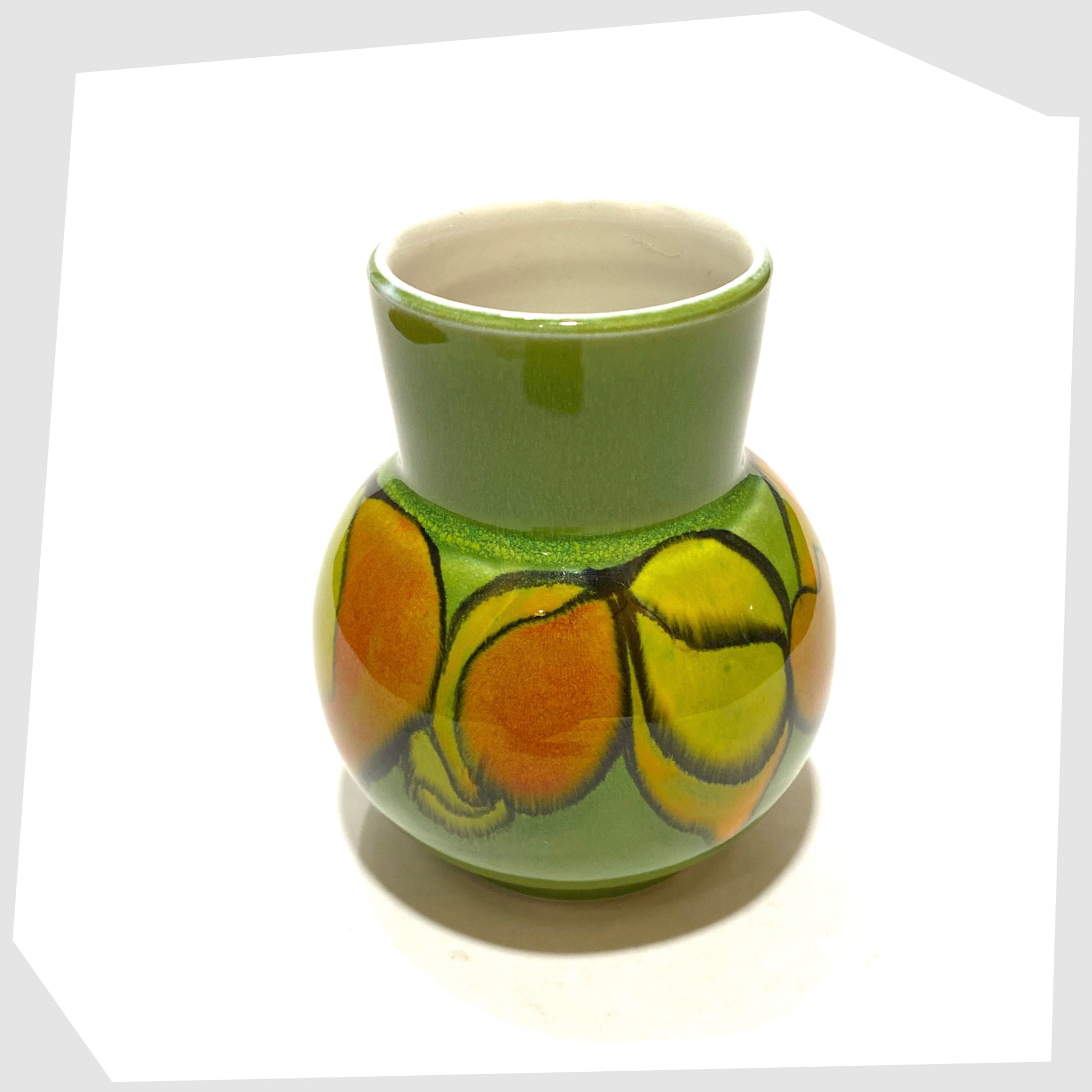 top rim of the vintage poole pottery vase, shape 31 by Julia Wills, finished in a green delphis glaze with yellow and orange forms