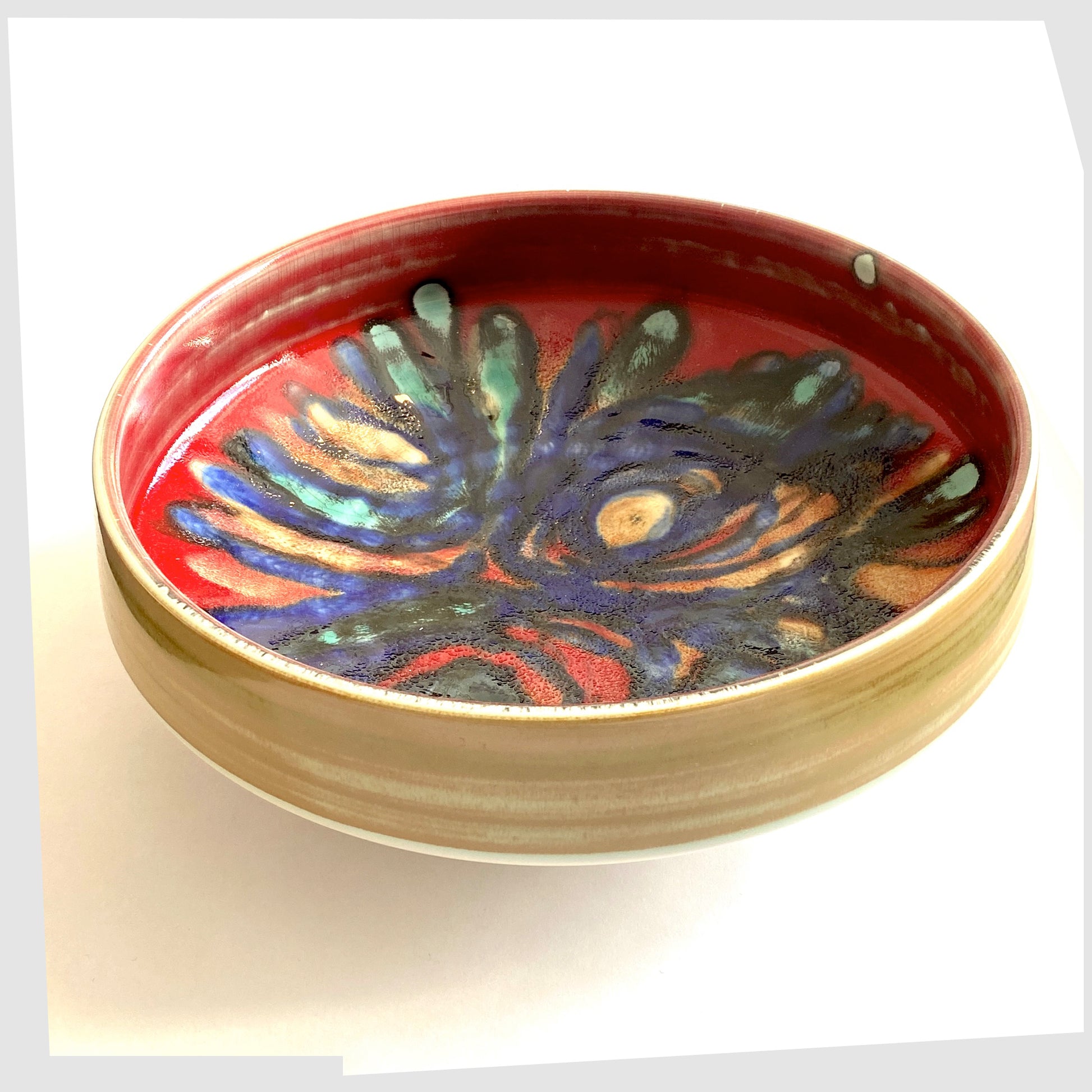 large Poole Pottery 11" Bowl in an artistic Delphis glaze of red, cobalt blue and turquoise