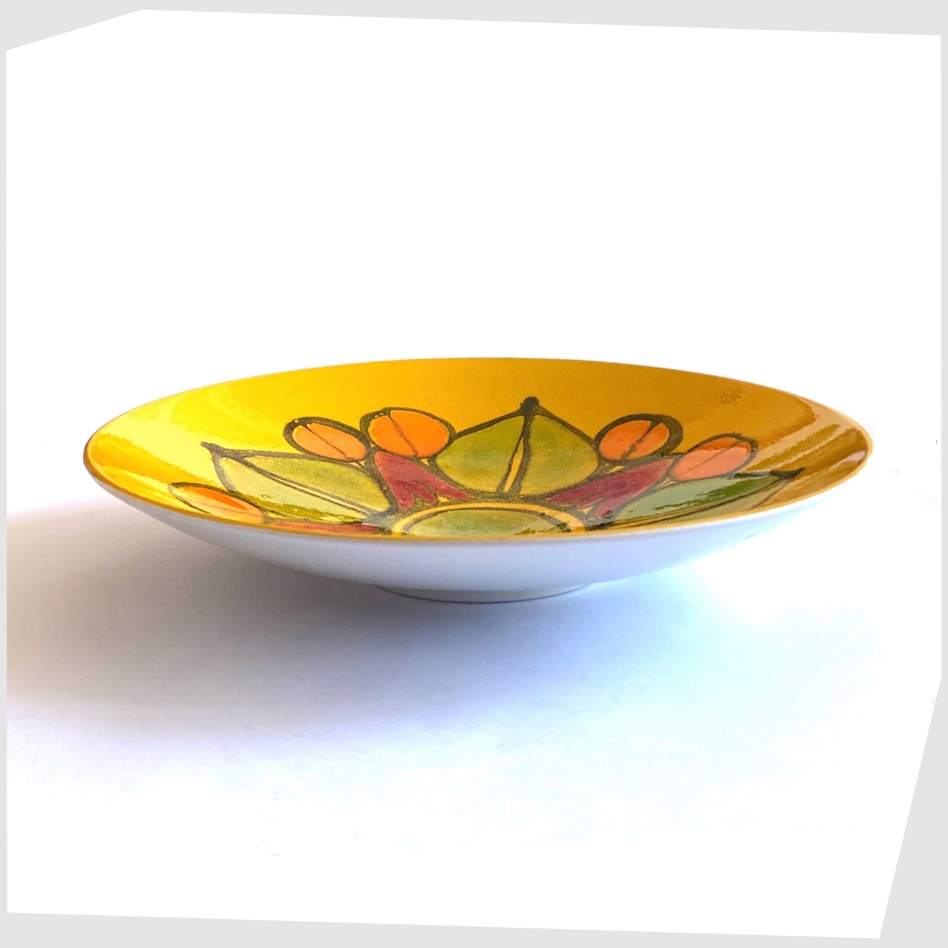 poole pottery delphis dish in mustard yellow with orange, red and green forms