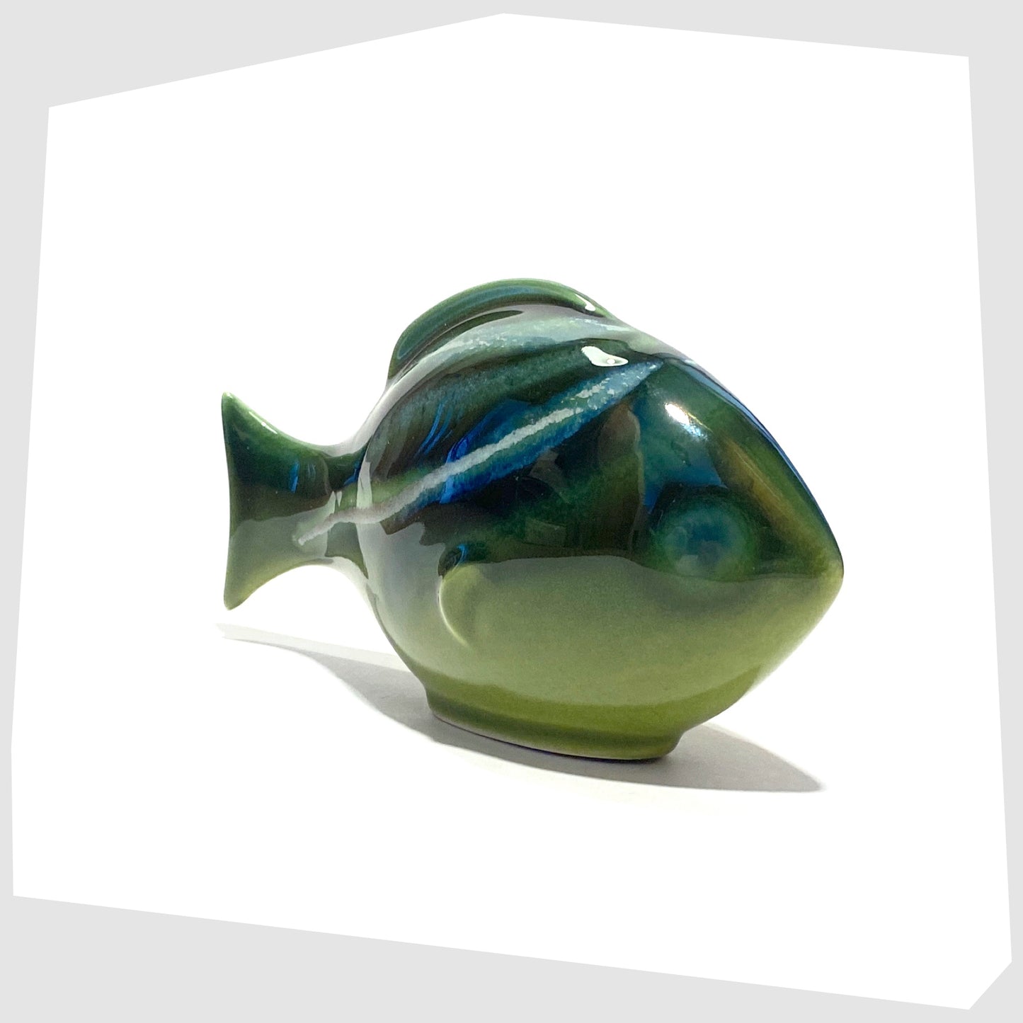front of the poole pottery large fish ornament in maya glaze of green, blue and warm grey