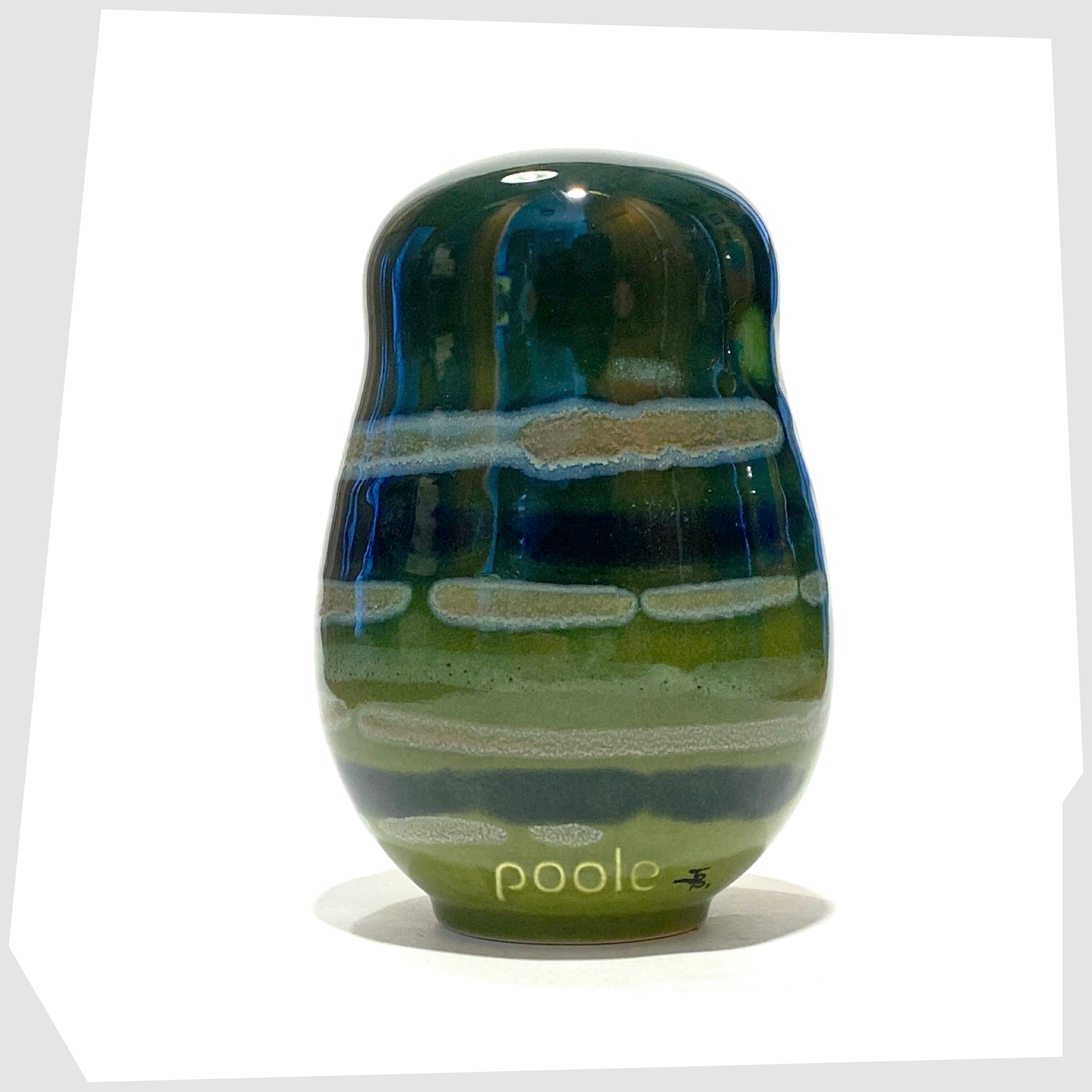 rear of the poole pottery large owl ornament glazed in the Maya finish of green, blue and warm grey
