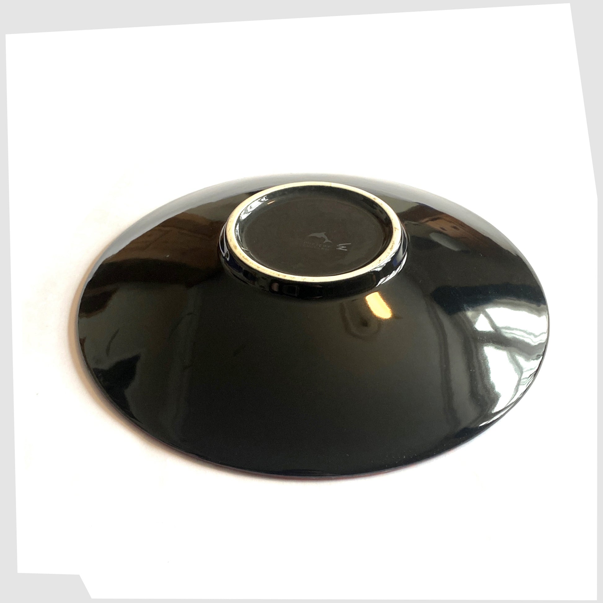 vase of the Poole Pottery Mosaic Dish finished in a deep black glaze 