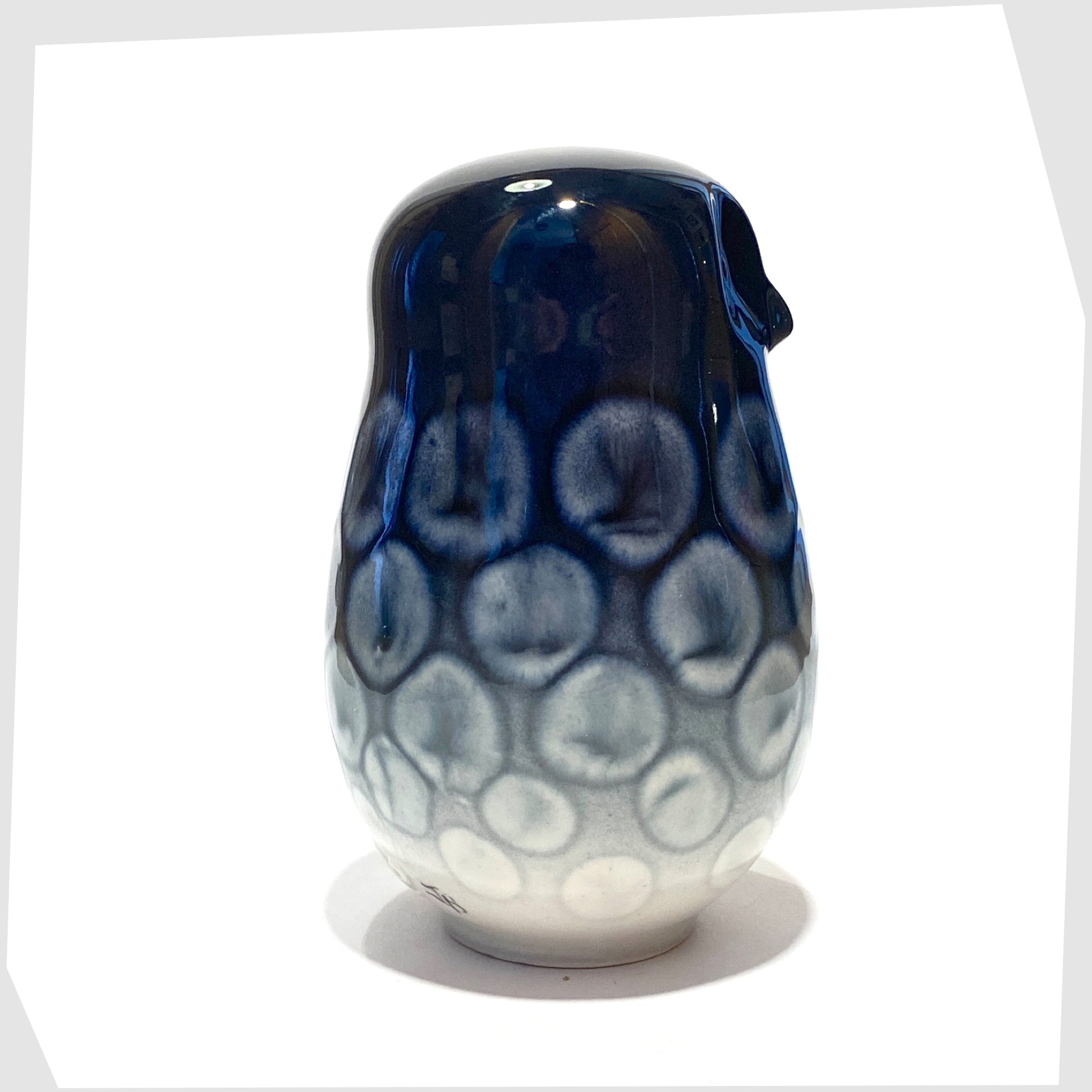 poole pottery large owl ornament in ocean glaze of navy blue with white circular forms