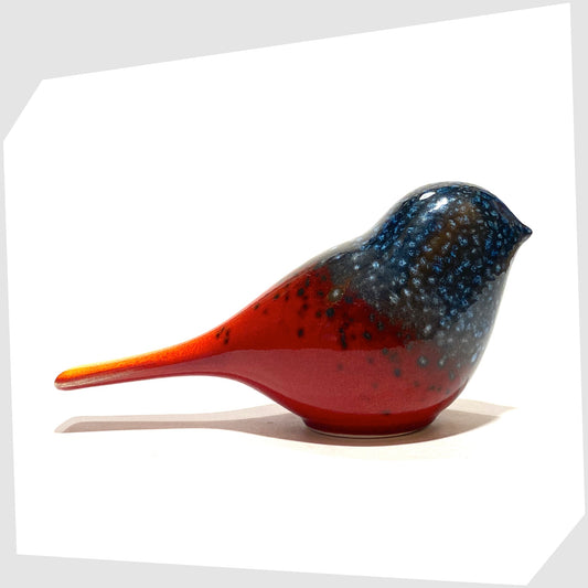 Poole Pottery Perching Bird in Flare glaze, designed by Alan Clarke, in rich red with black and blue speckles