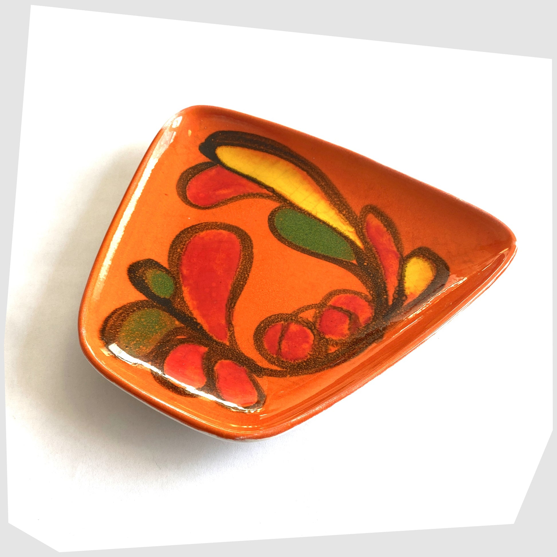 Poole Pottery Delphis Dish, shape 81, by paintress Mary Albon in a vivid orange glaze with fluid forms of red, green and yellow