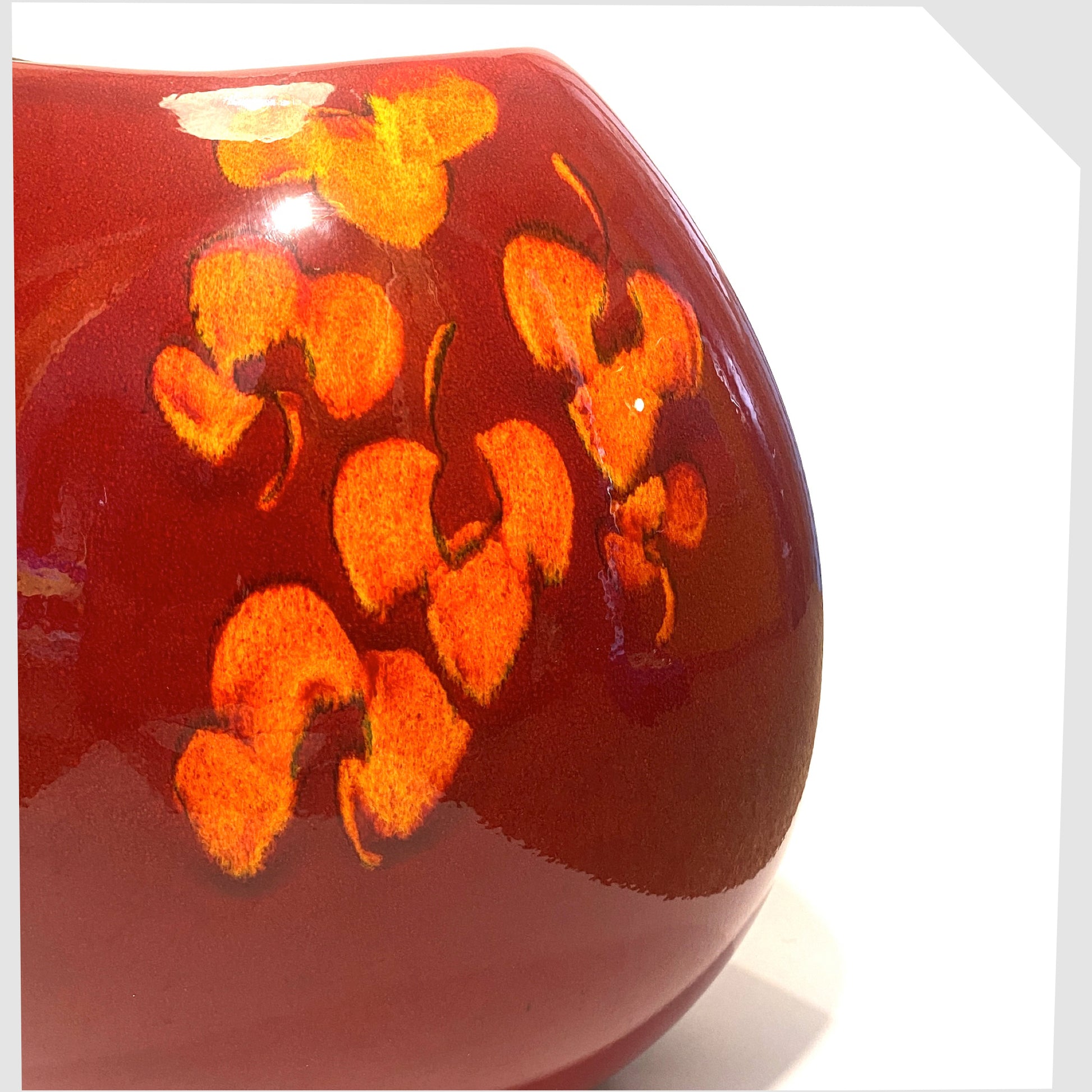 red and orange glazing on the large poole pottery purse vase