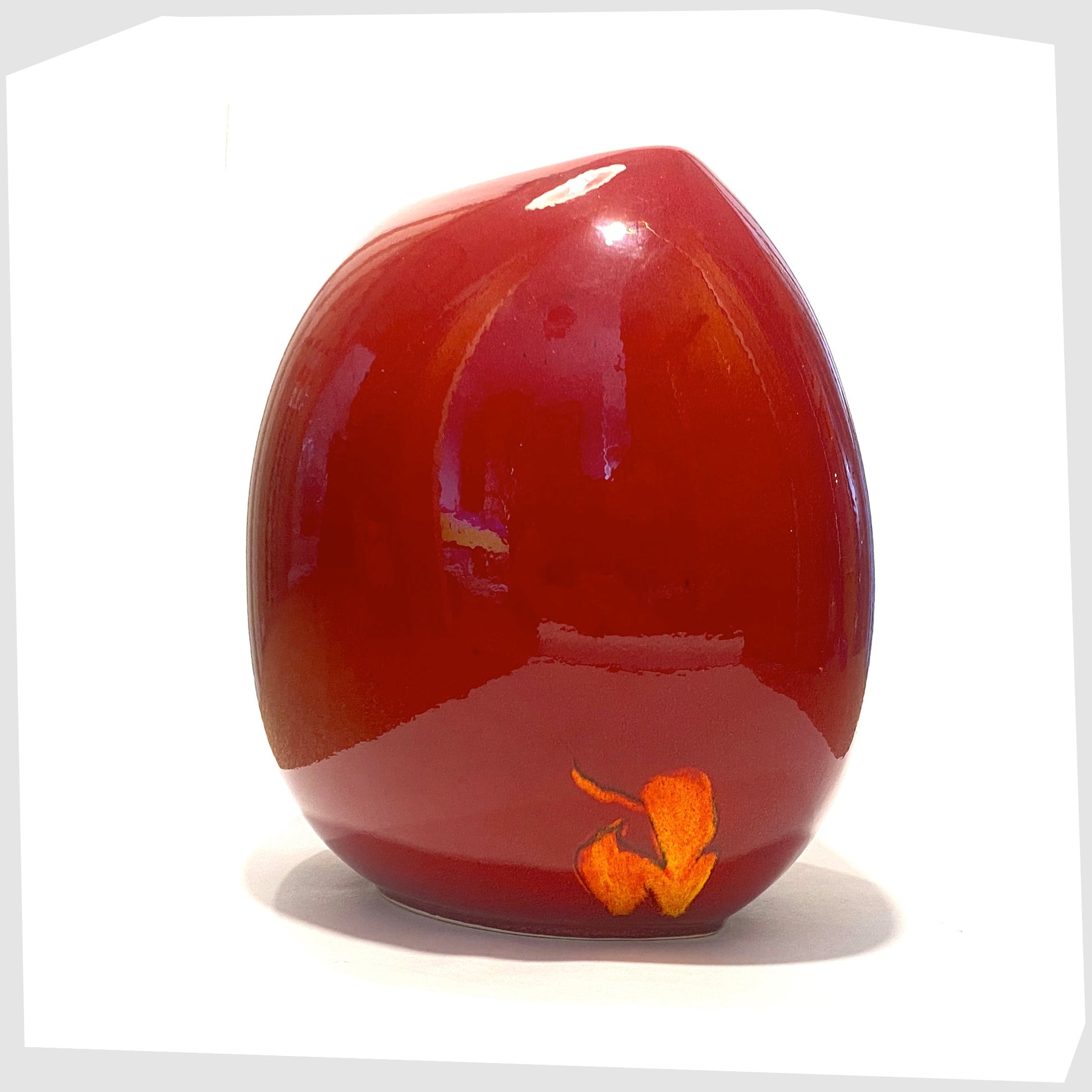 rear of the poole pottery purse vase in red with orange floral design