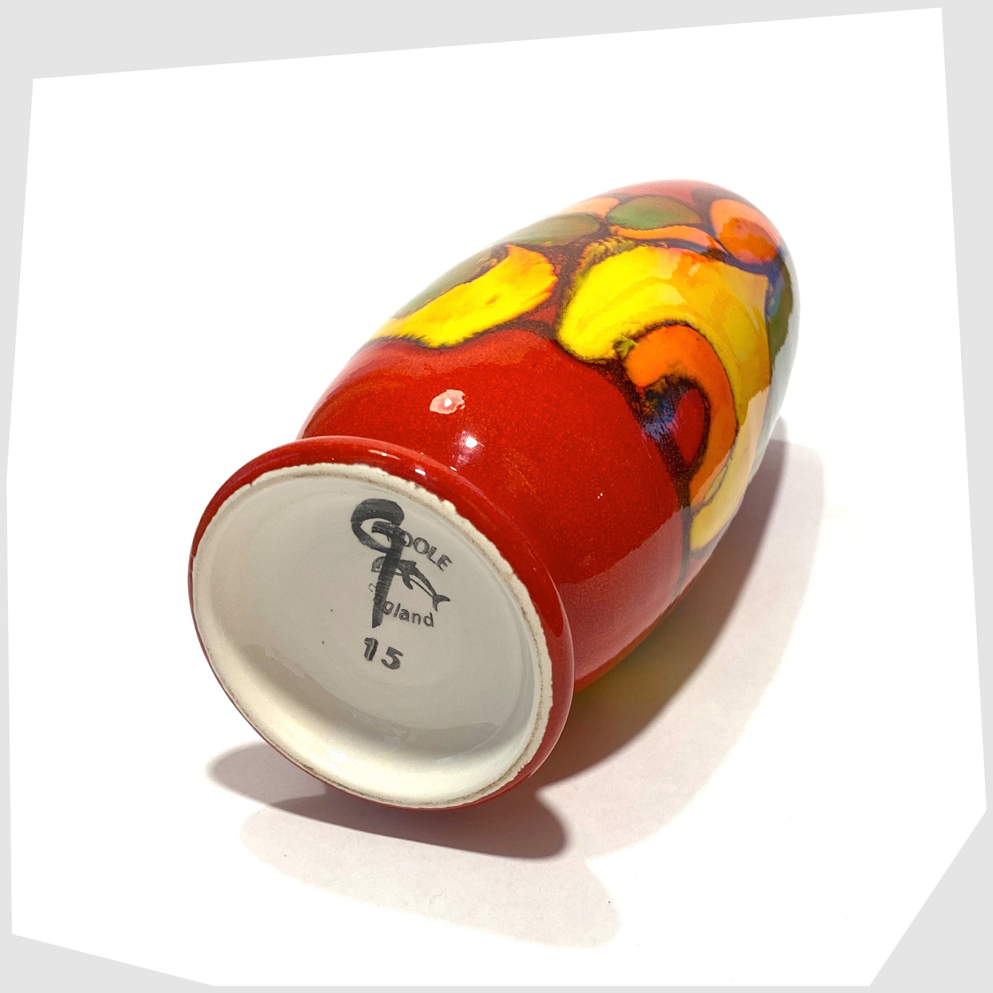 base stamp on the poole pottery delphis vase, shape 15, glazed in a vivid red with flowing forms of yellow, green and orange