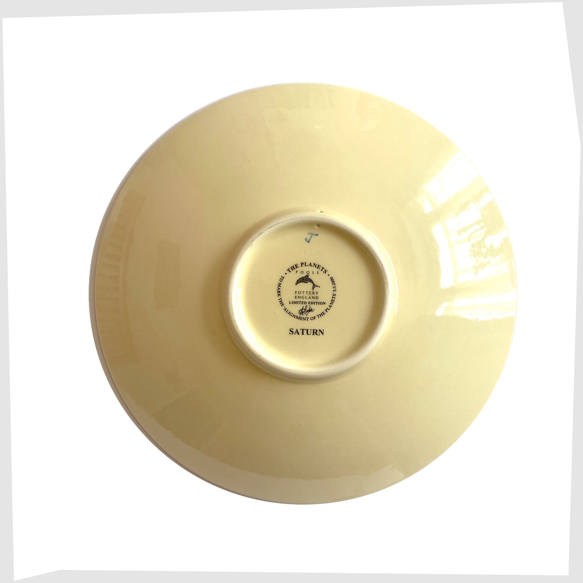 rear of the poole pottery decorative Saturn plate designed by Alan Clarke to mark the alignment of the planets in 2000.