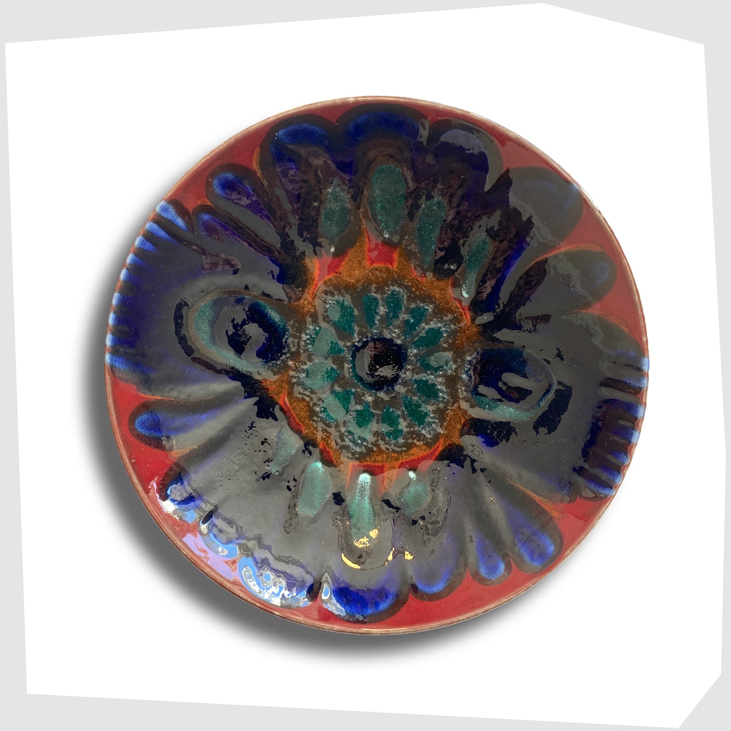 Poole Pottery Dish by Carloyn Bartlett glazed in a radiating design of red, cobalt blue and teal green
