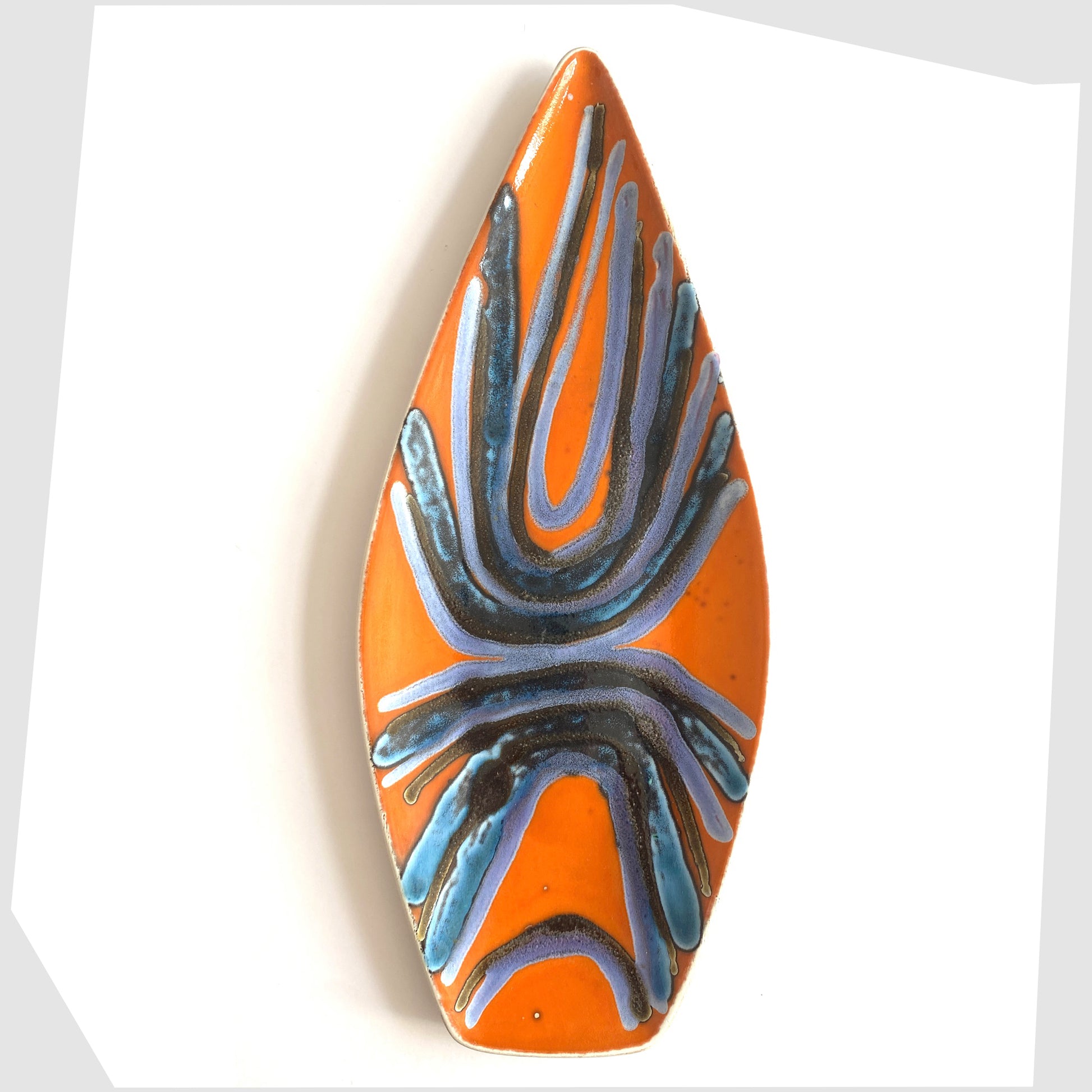 1960s Poole Pottery Delphis Spear Dish by Margaret Anderson in a fiery orange glaze with radiating lines of blue and purple glaze