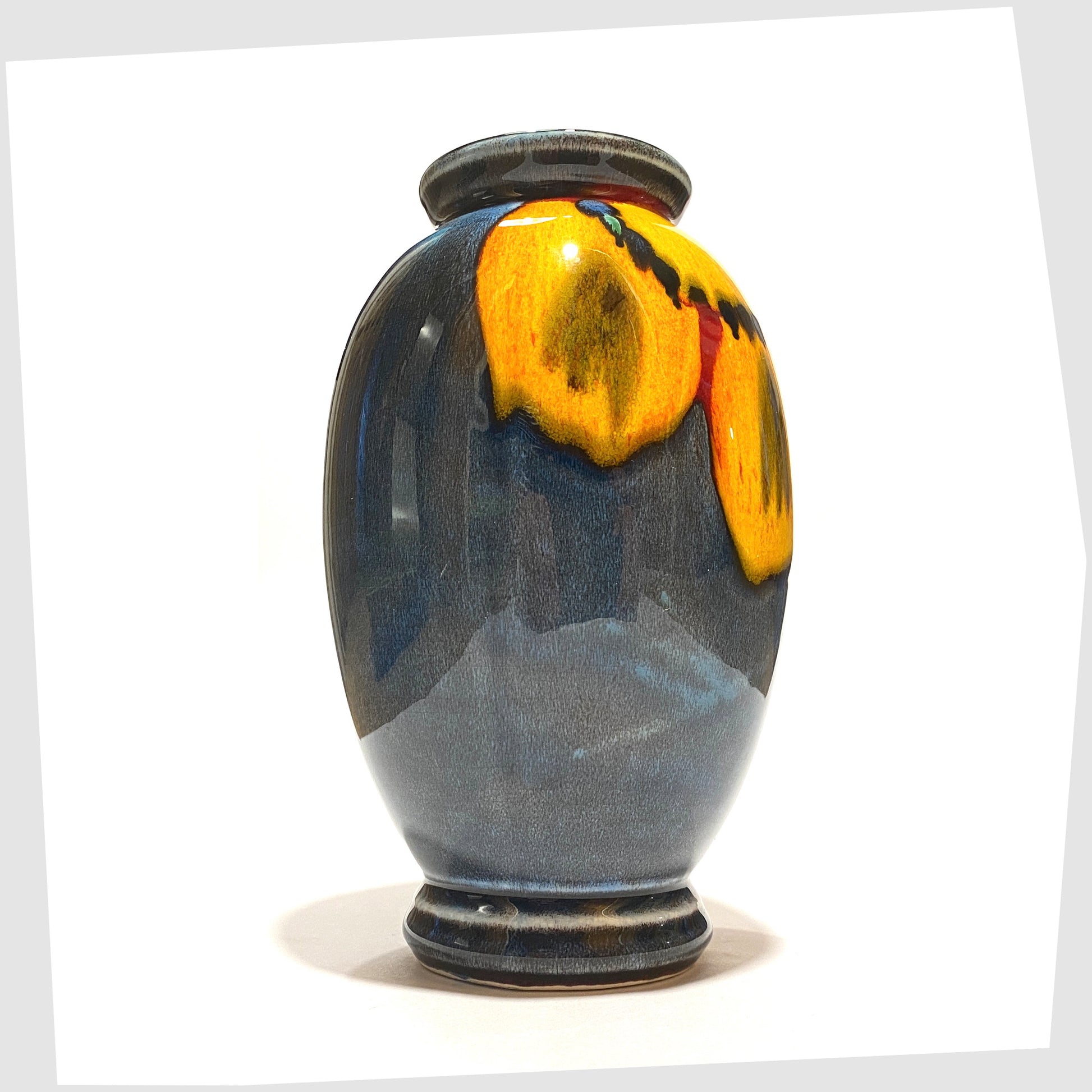 Poole Pottery Wild Poppy Vase in a marbled blue glaze with vivid yellow wild poppy flower