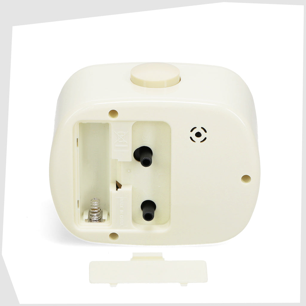 rear of the Cream Retro Alarm Clock, by Rex London, showing its adjustment knobs and battery compartment