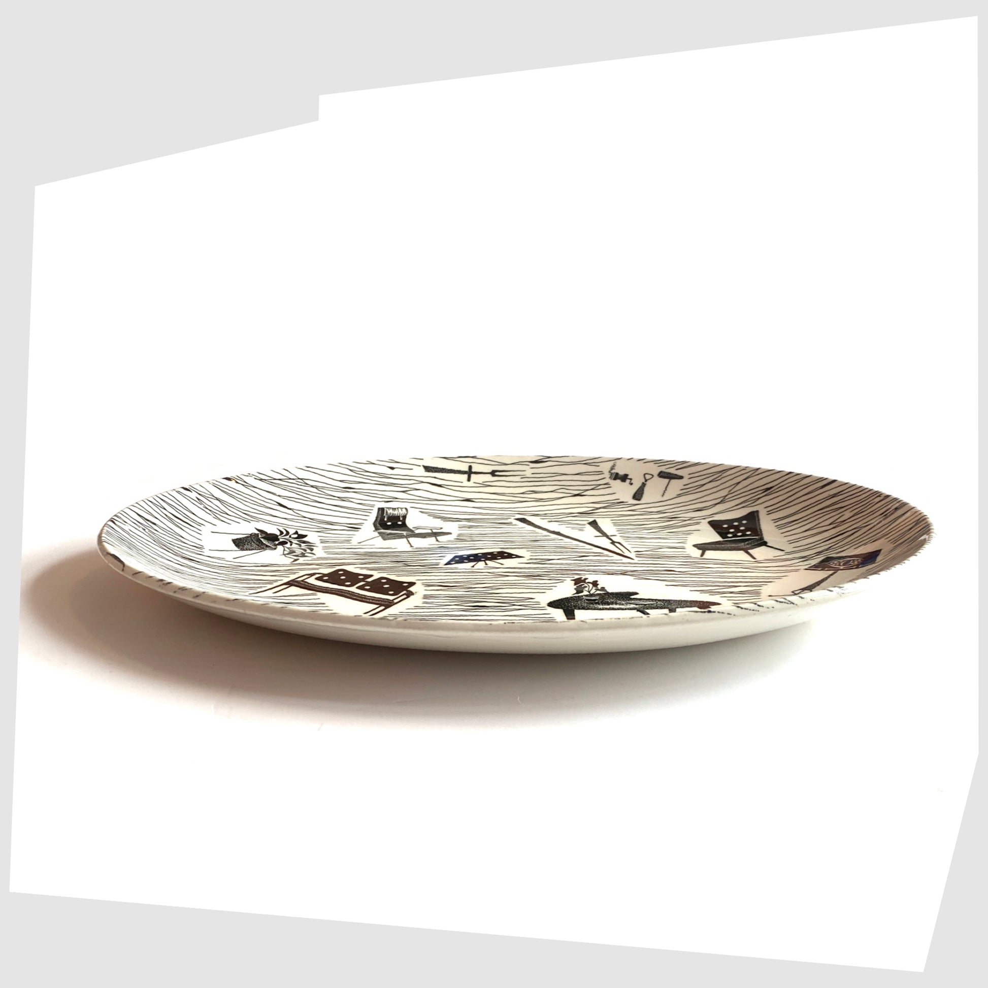 Side profile of the Ridway Pottery Homemaker Oval Platter with mid-century modern design in monochrome, shown on a white background