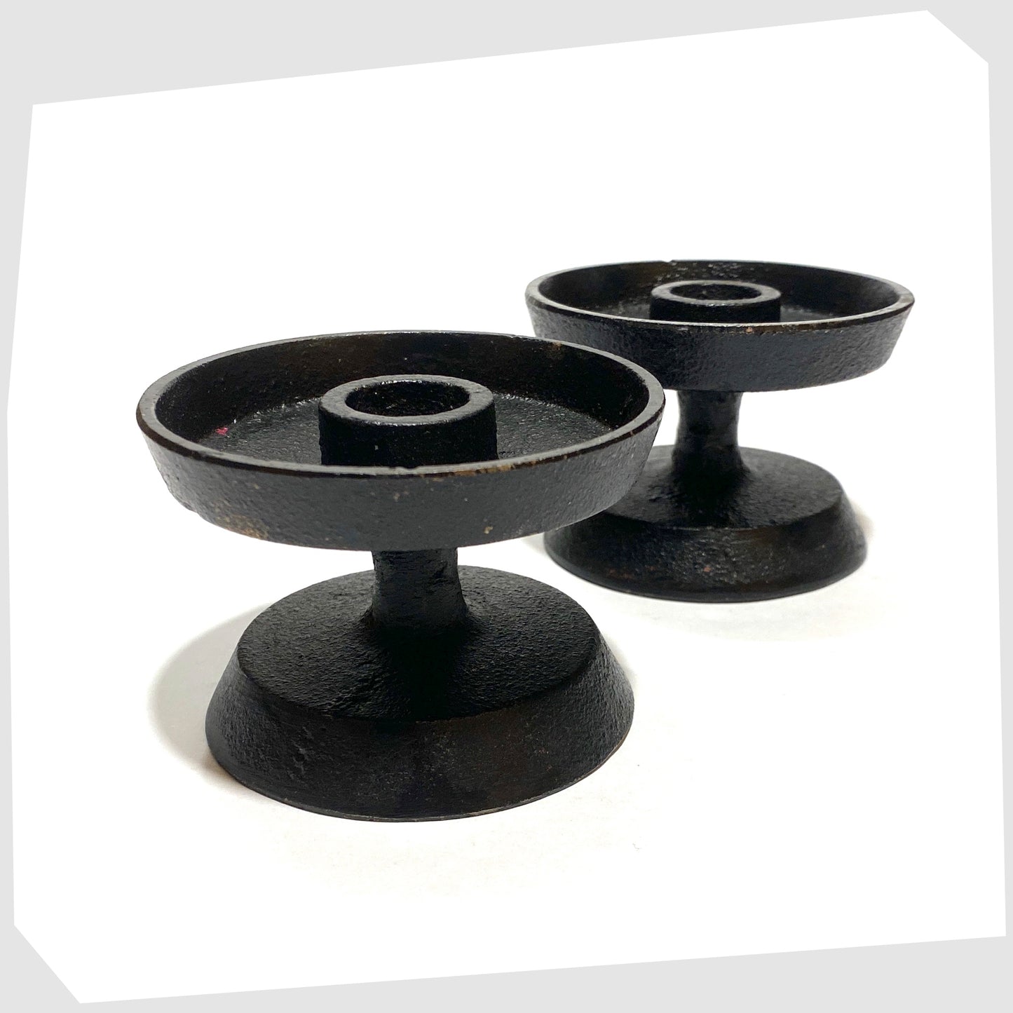 pair of robert welsh inspired candleholder made of black cast iron