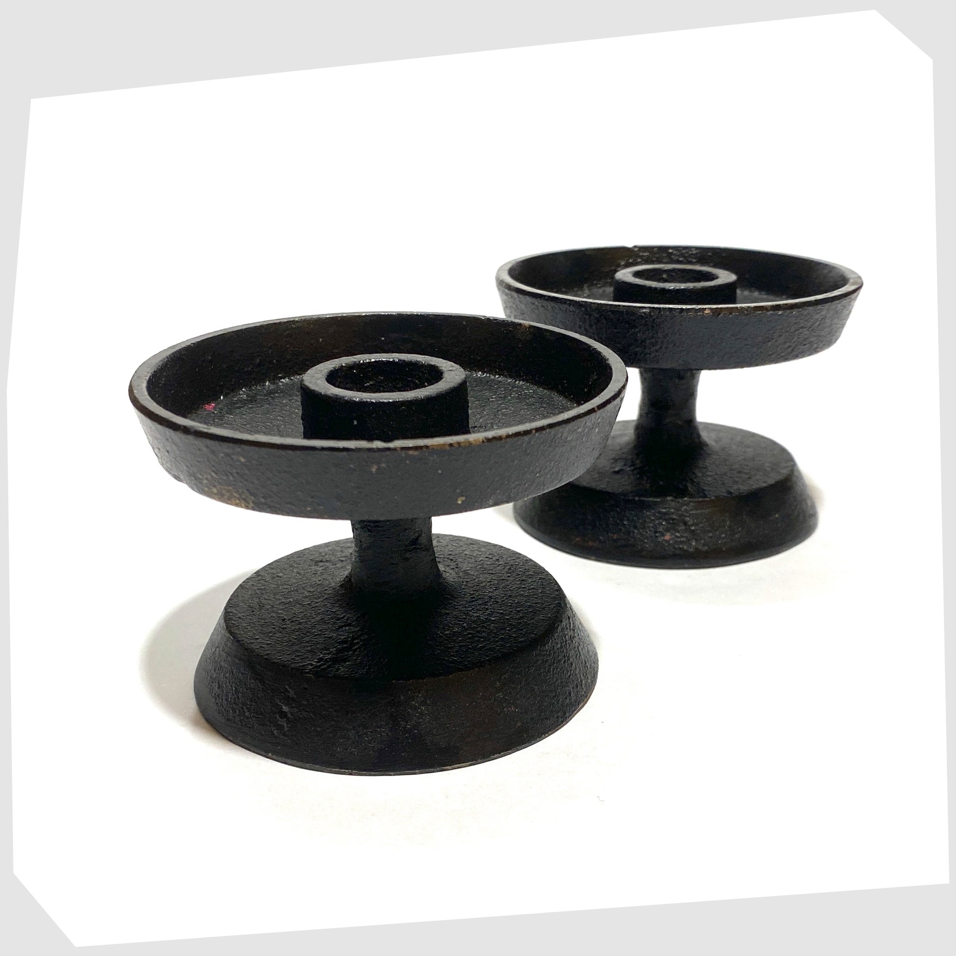 pair of robert welsh inspired candleholder made of black cast iron