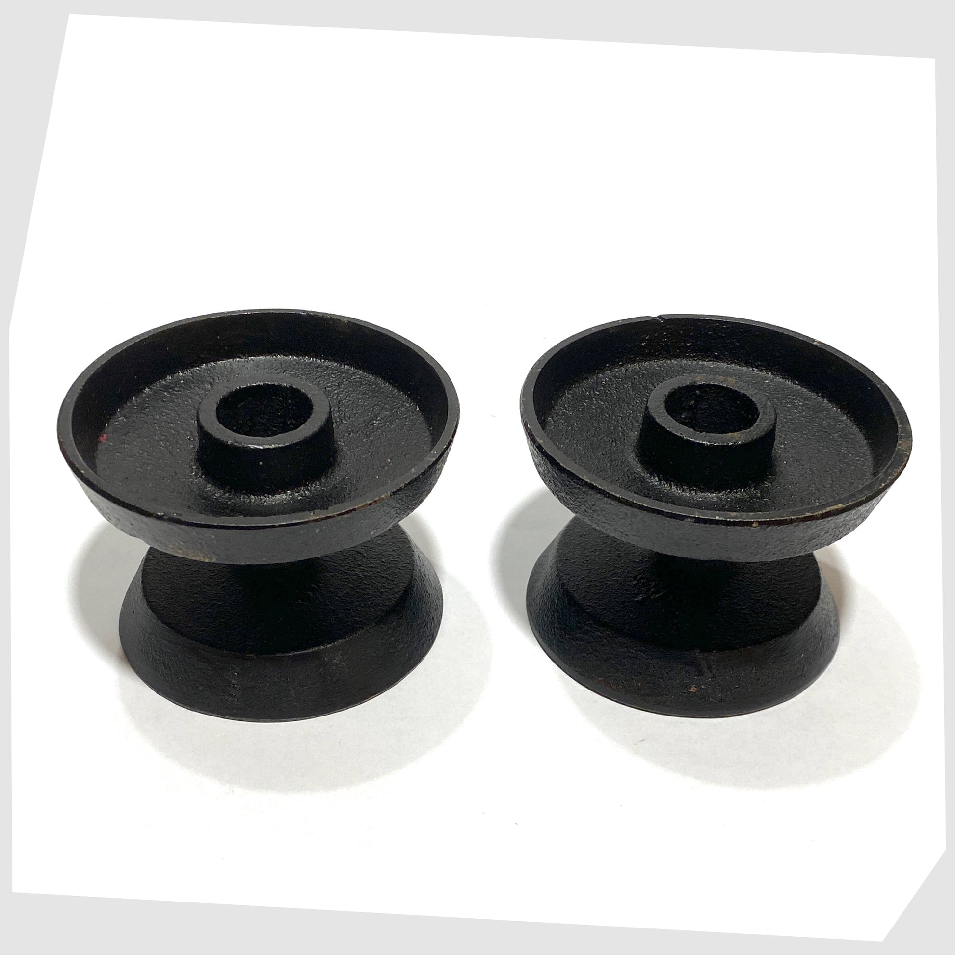 pair of robert welsh inspired candleholder made of black cast iron 