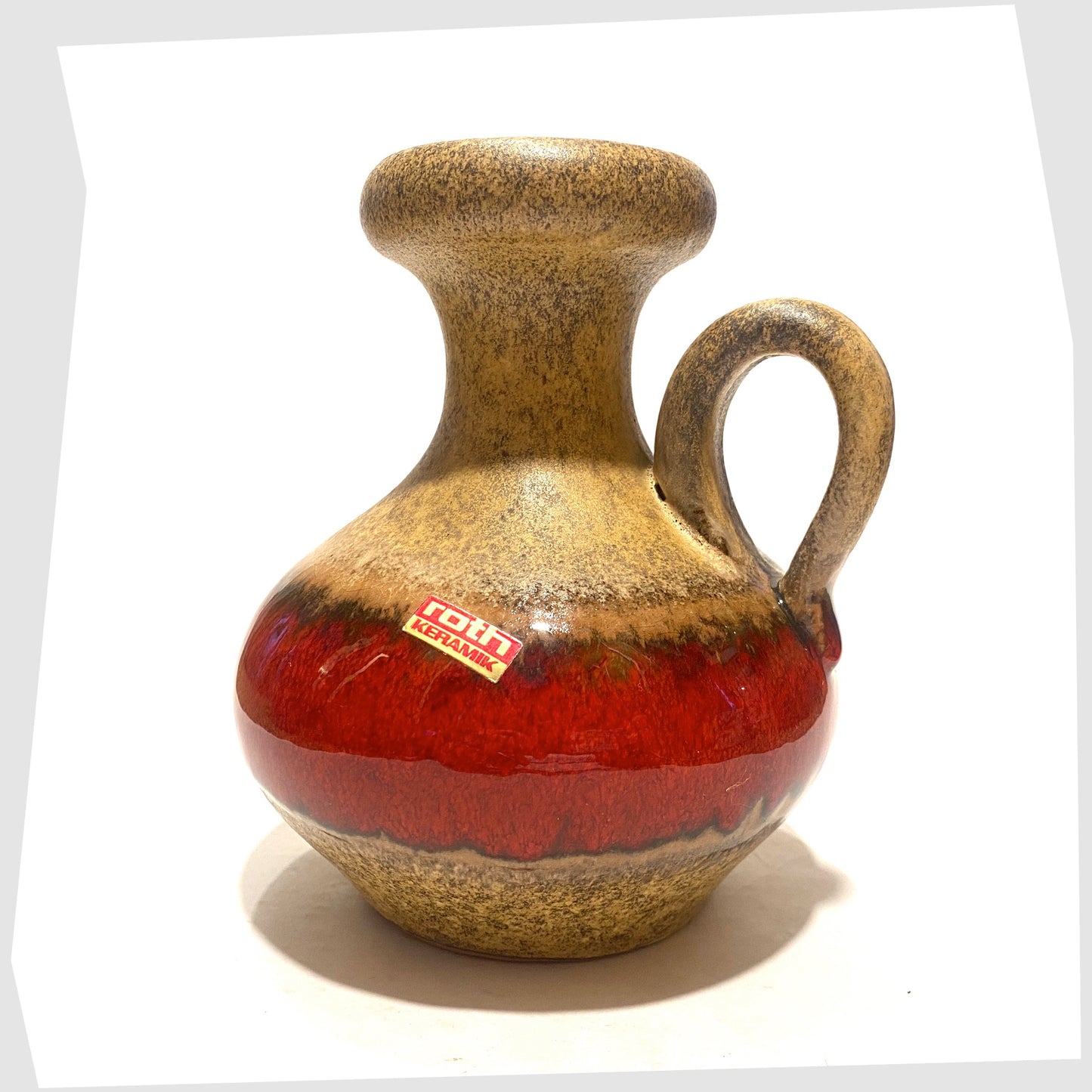 1970s roth keramik vase with curved handle with a central stripe of volcanic red glaze