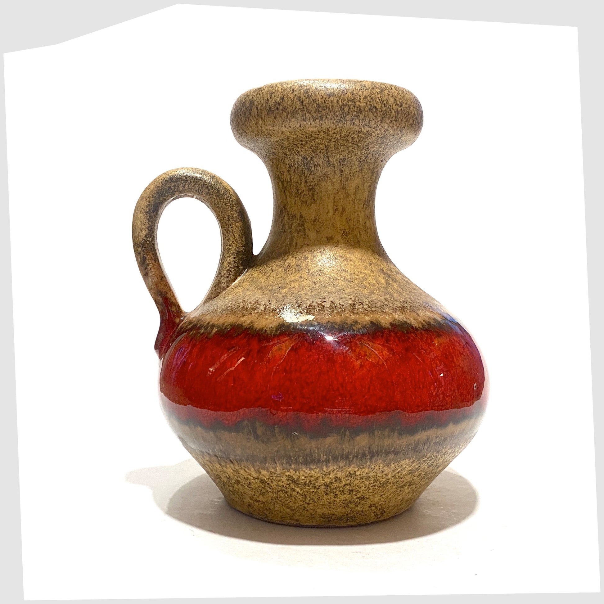 vintage roth keramik vase with curved handle with a central stripe of volcanic red glaze