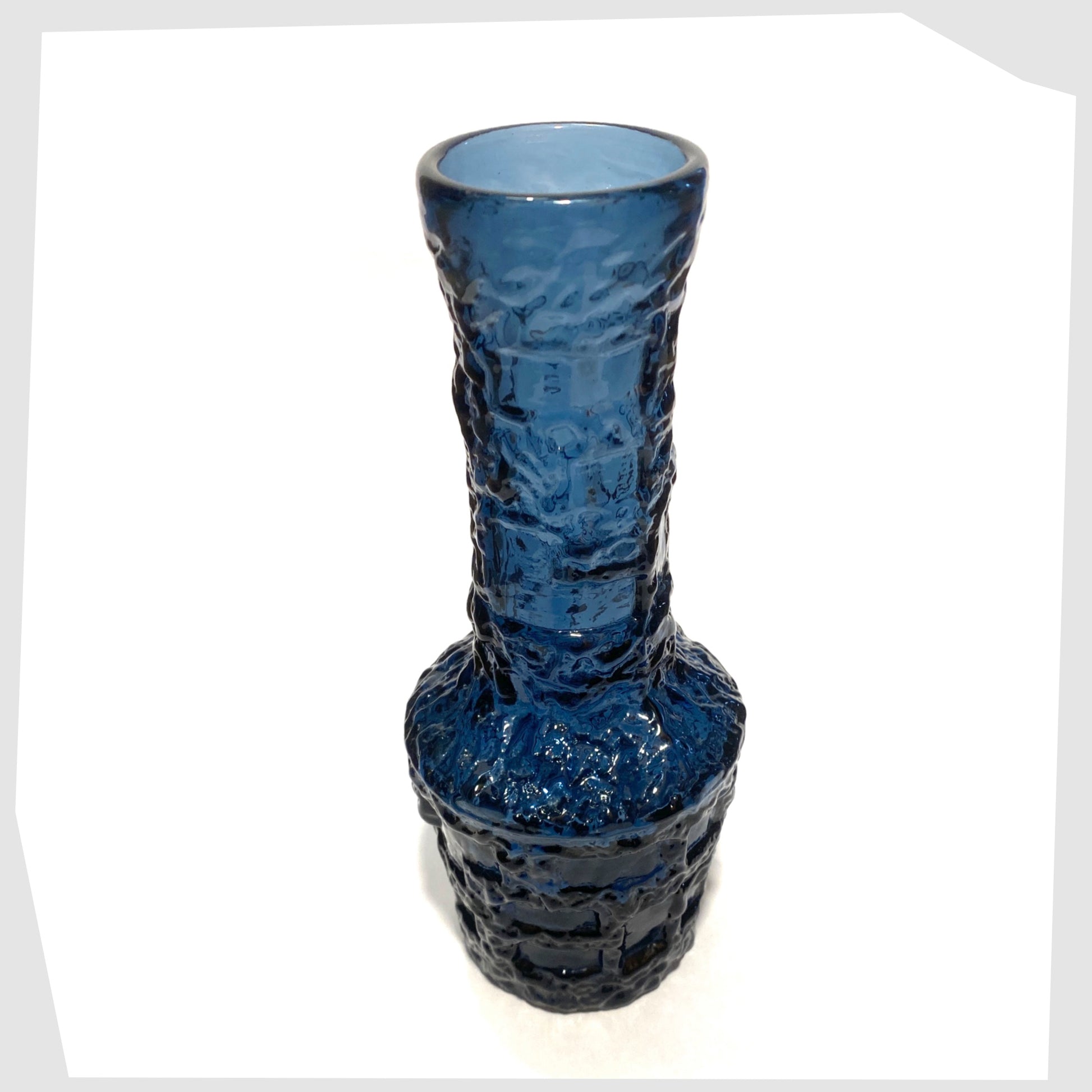 Top rim of the Ruda Glasbruk Vase in a Cobalt Blue glass with  eep bark texture