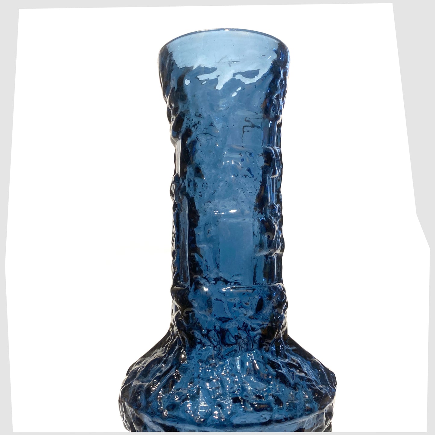 top section of the Ruda Glasbruk Vase in a Cobalt Blue glass with  eep bark texture