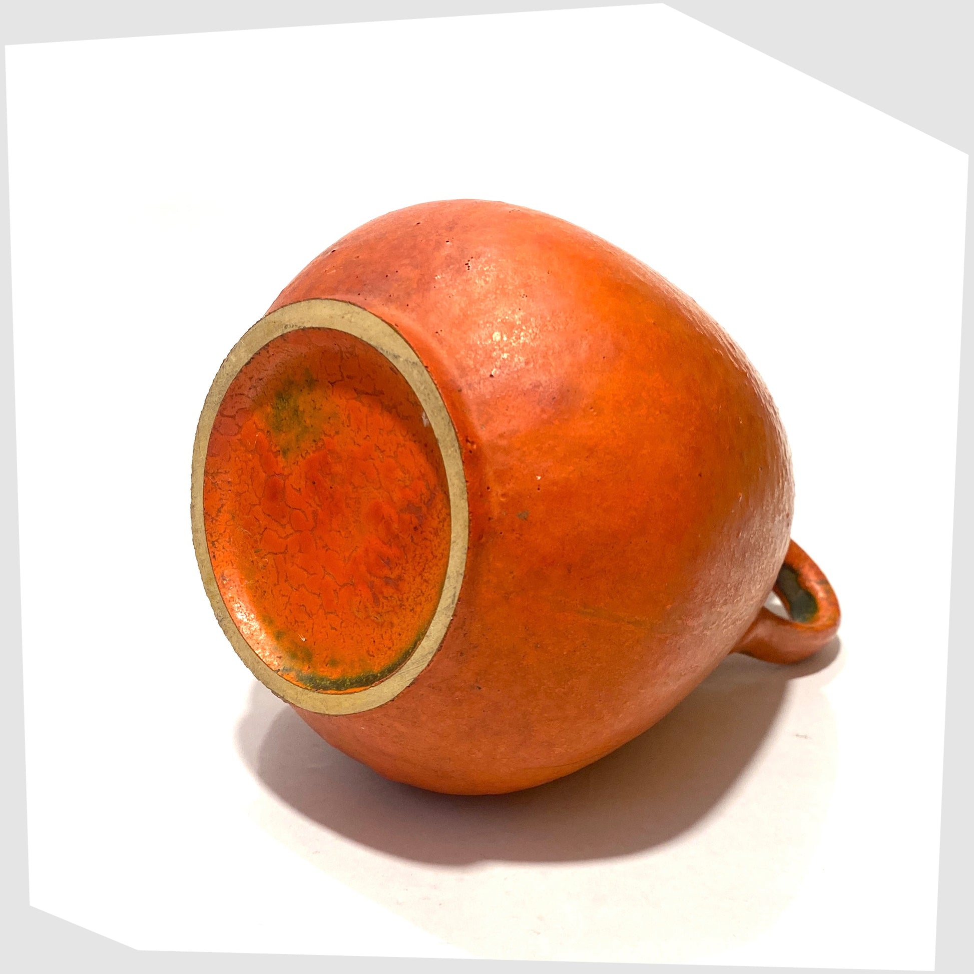 Base of the Ruscha Keramik Vase in matte volcanic orange glaze, shown on a white background