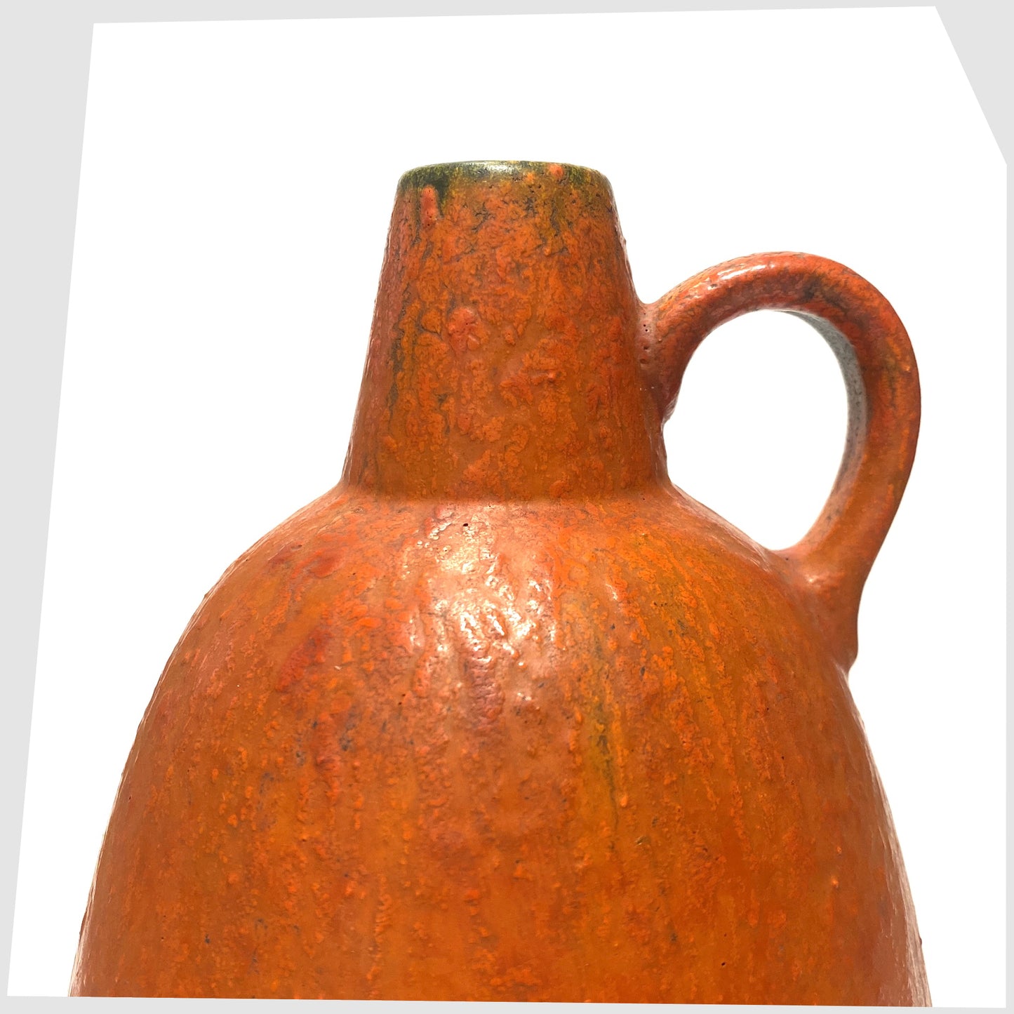 Close up of the looped handle of the Ruscha Keramik Vase in matte volcanic orange glaze, shown on a white background