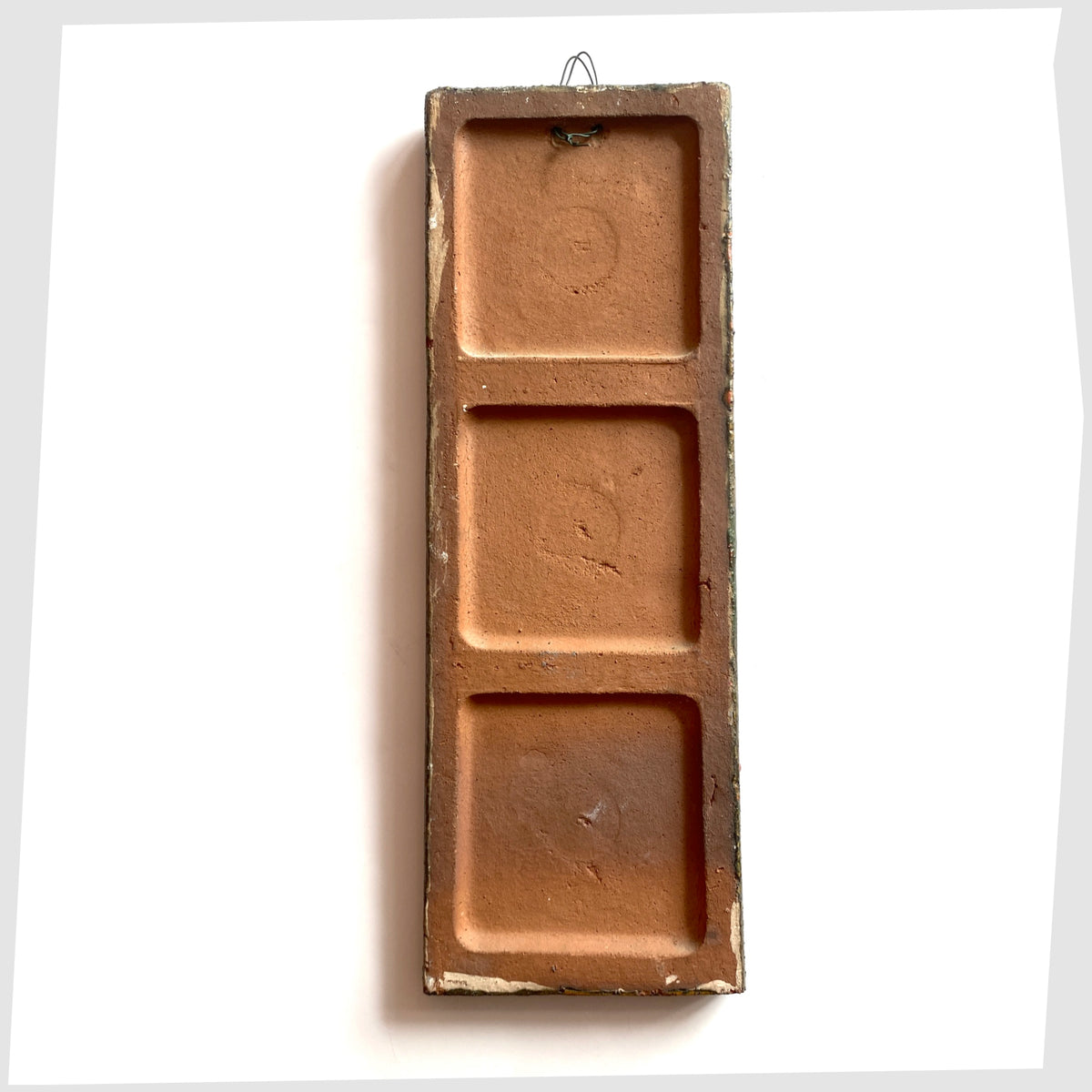 Rear of the Ruscha Keramik Wall Plaque, designed by Adele Bolz, shown on a white background