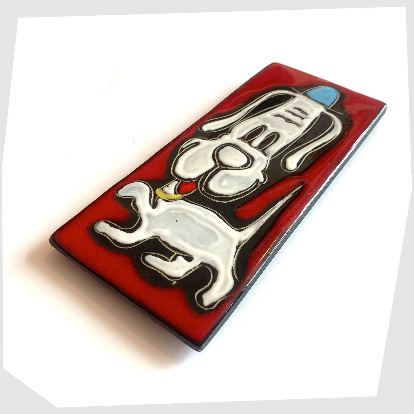 1960s rectangular San Marino Pottery Wall Plaque featuring a white dog in a blue hat on a vibrant red glaze, shown on a white background