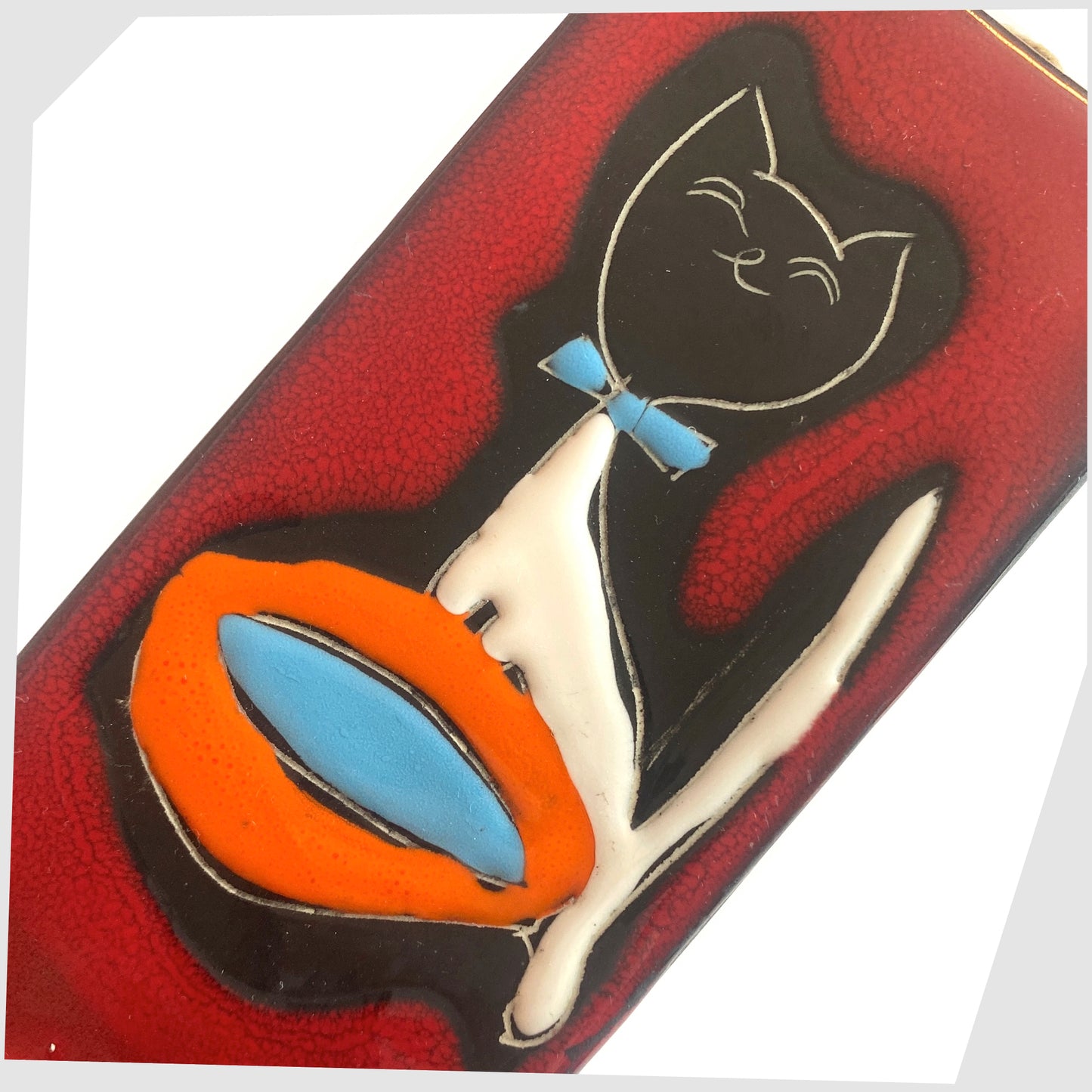 Close up of the San Marino Pottery Wall Plaque featuring a black cat with blue bow tie and orange water bowl on a vibrant red glaze, shown on a white background