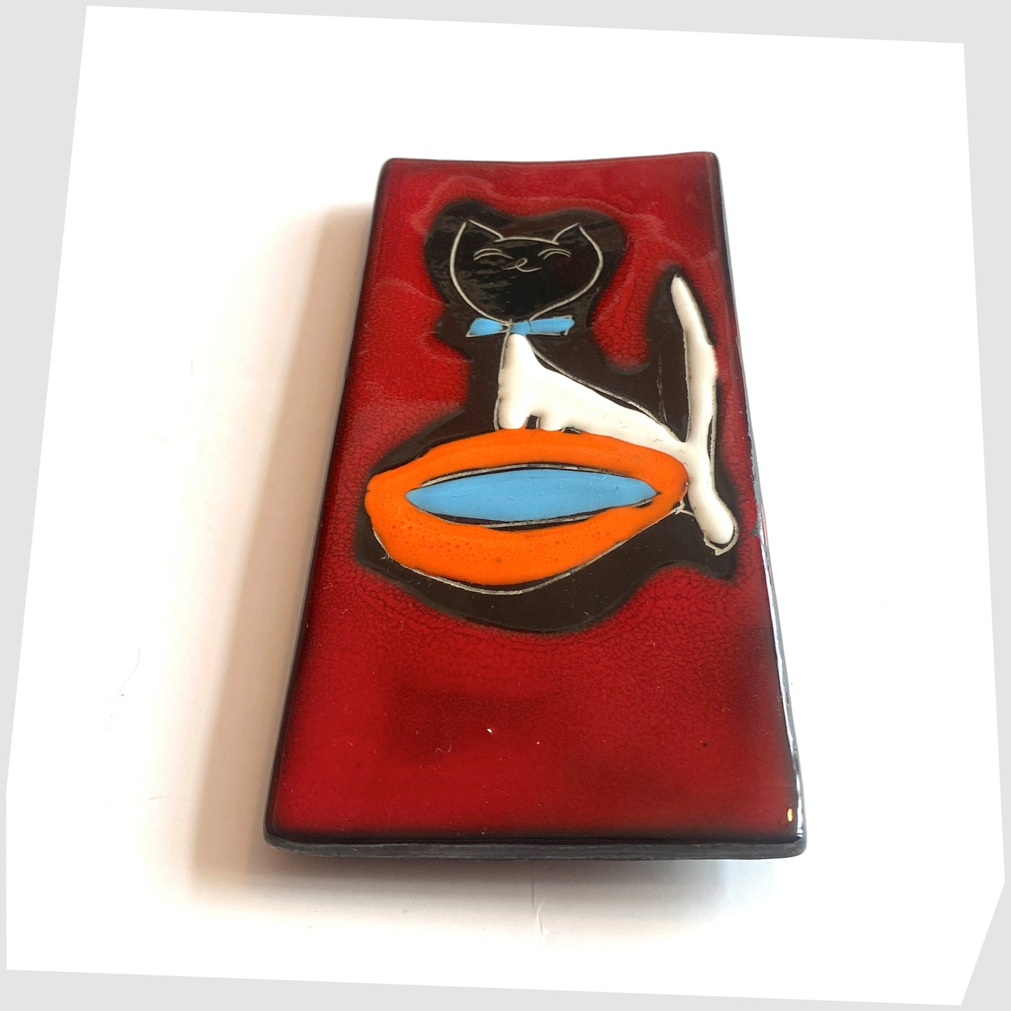 San Marino Pottery Wall Plaque featuring a black cat with blue bow tie and orange water bowl on a vibrant red glaze, shown on a white background