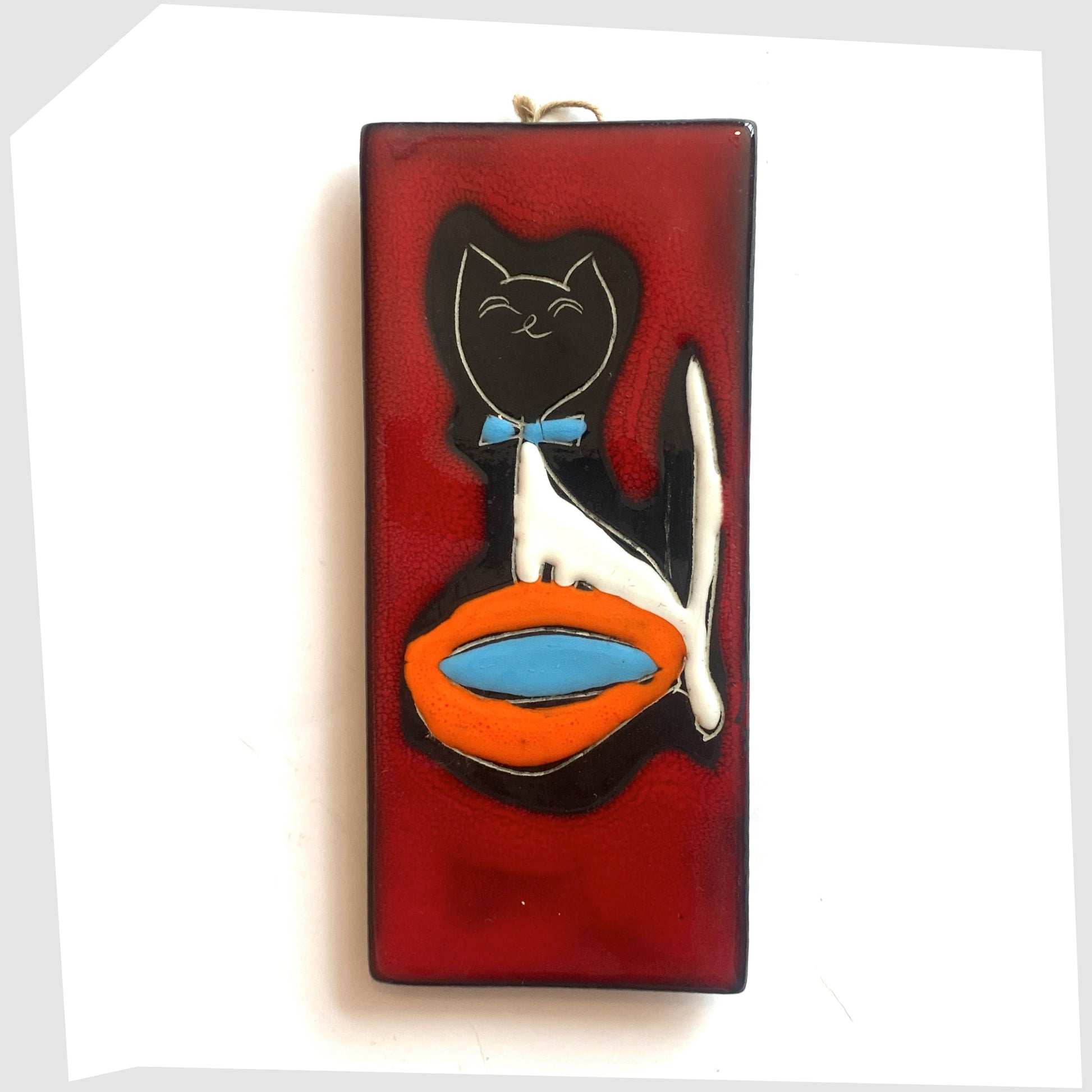 Rectangular San Marino Pottery Wall Plaque featuring a black cat with blue bow tie and orange water bowl on a vibrant red glaze, shown on a white background