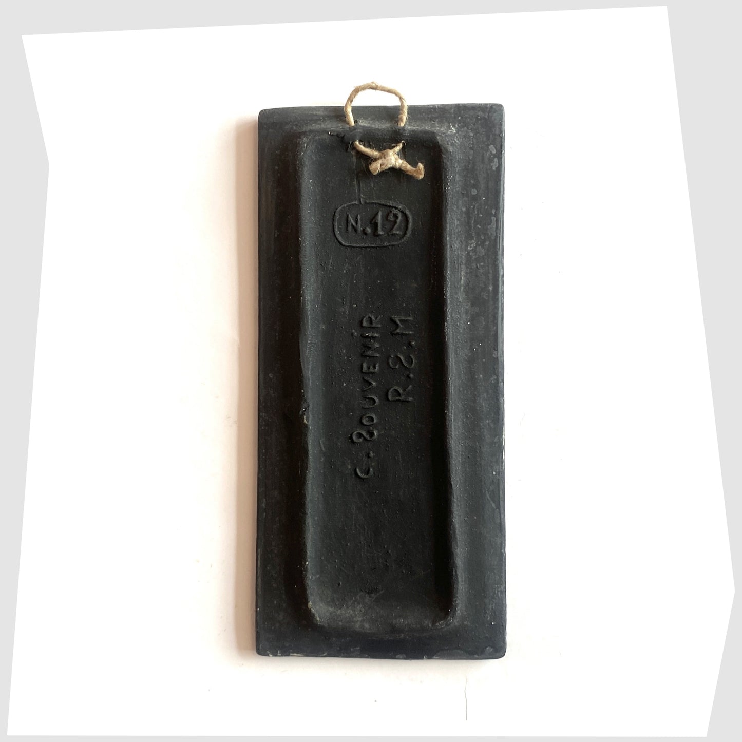 Rear of the rectangular San Marino Pottery Wall Plaque with impressed model number and string hanging loop, shown on a white background