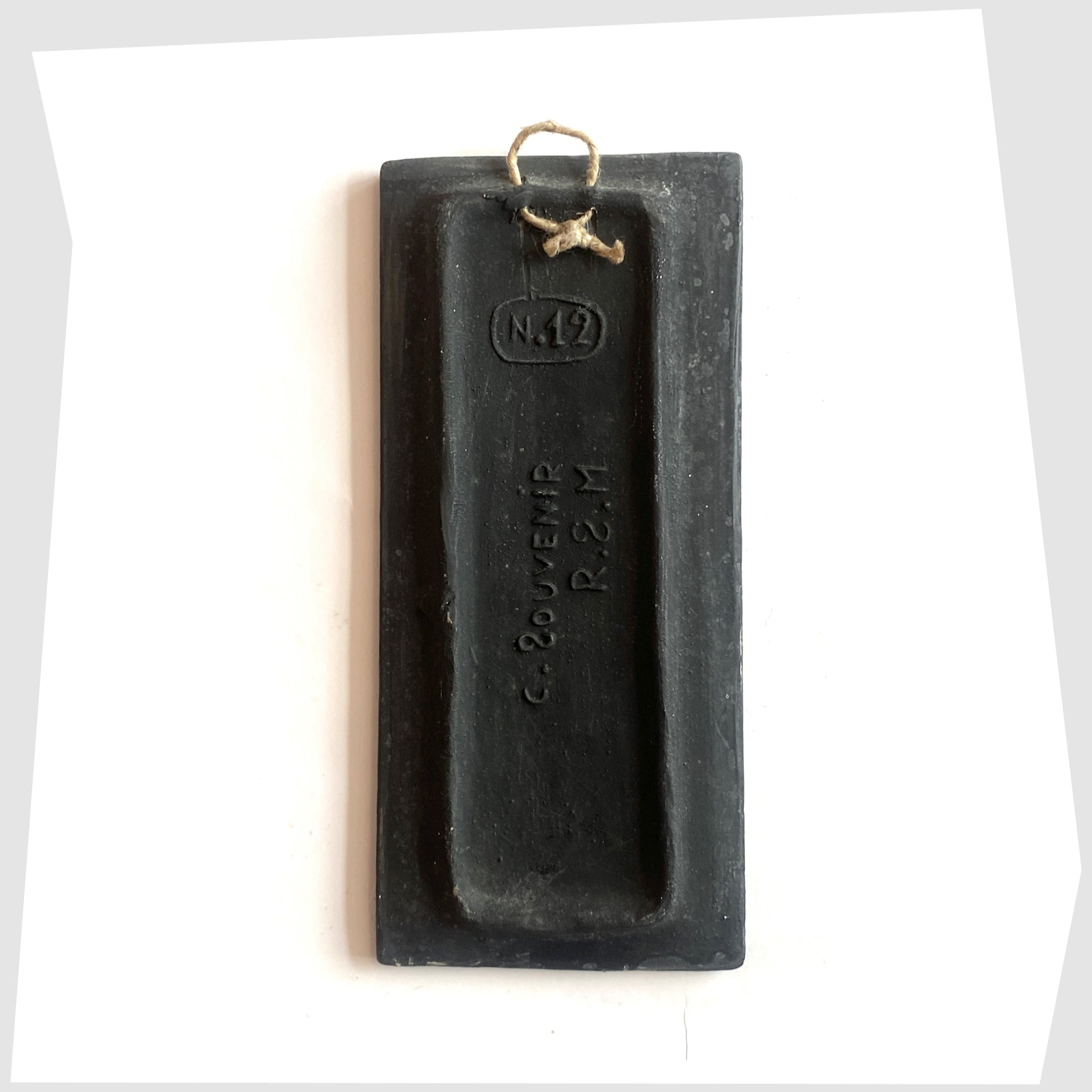 Rear of the rectangular San Marino Pottery Wall Plaque with impressed model number and string hanging loop, shown on a white background