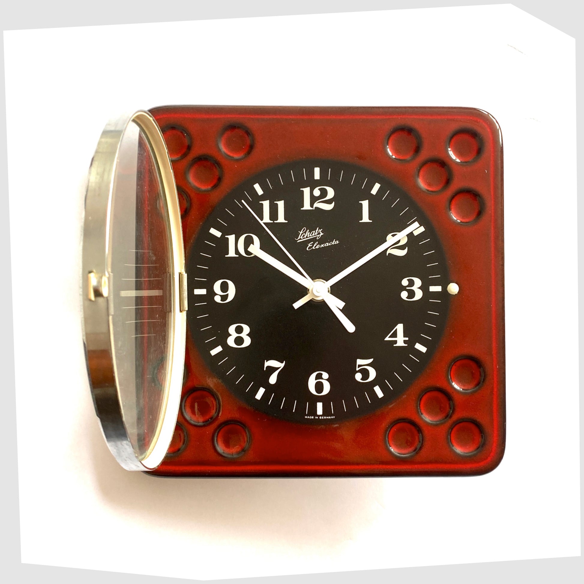vintage west german pottery wall clock made of rich red ceramic with black and white dial covered with a glass dome