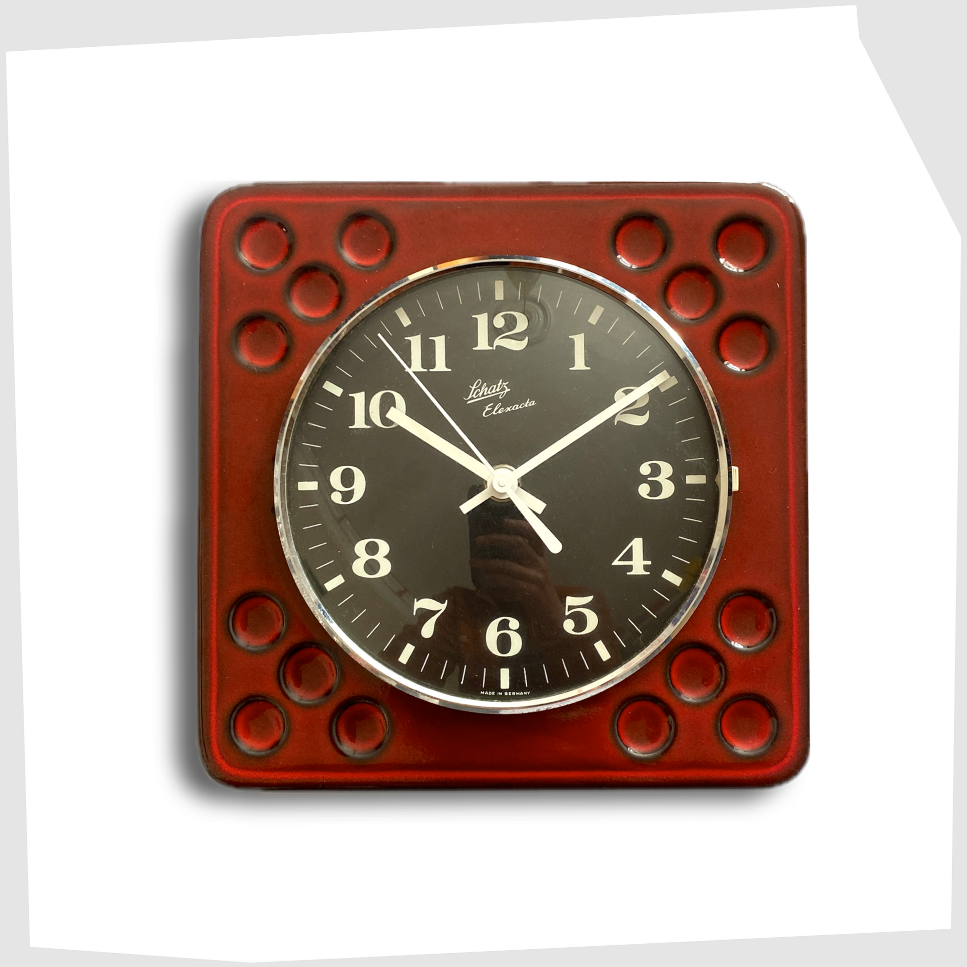 west german pottery wall clock made of rich red ceramic with black and white dial