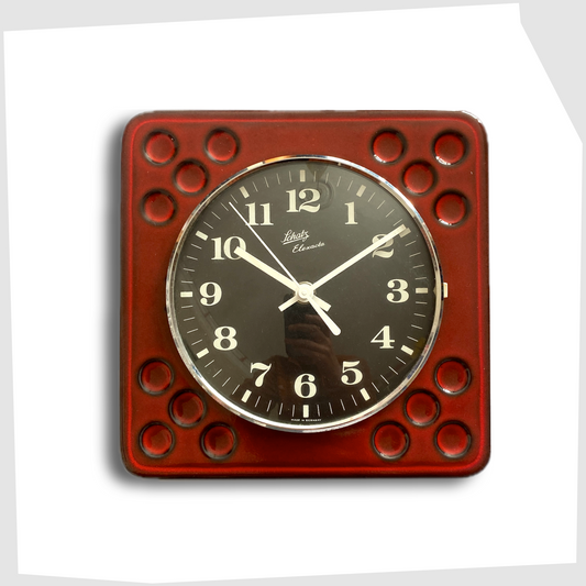west german pottery wall clock made of rich red ceramic with black and white dial