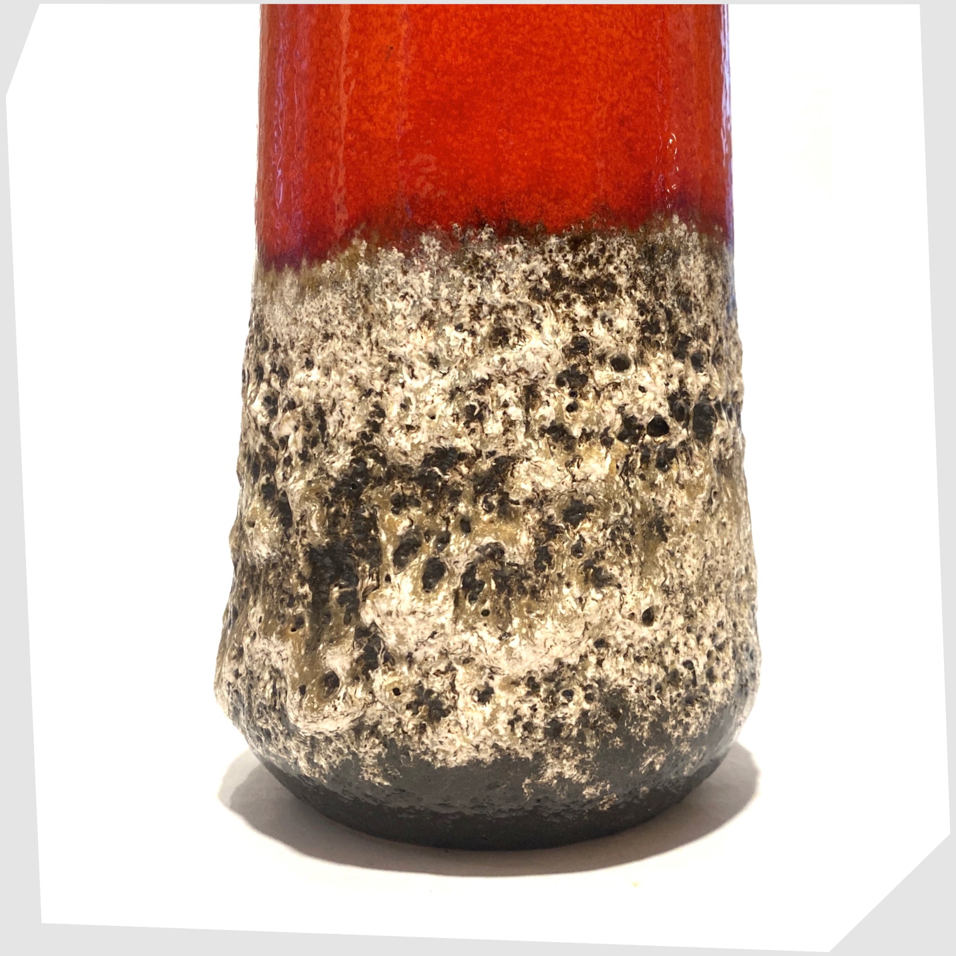 lower section of the scheurich keramik 206-26 vase in a deep fat lava glaze with central band of volcanic red