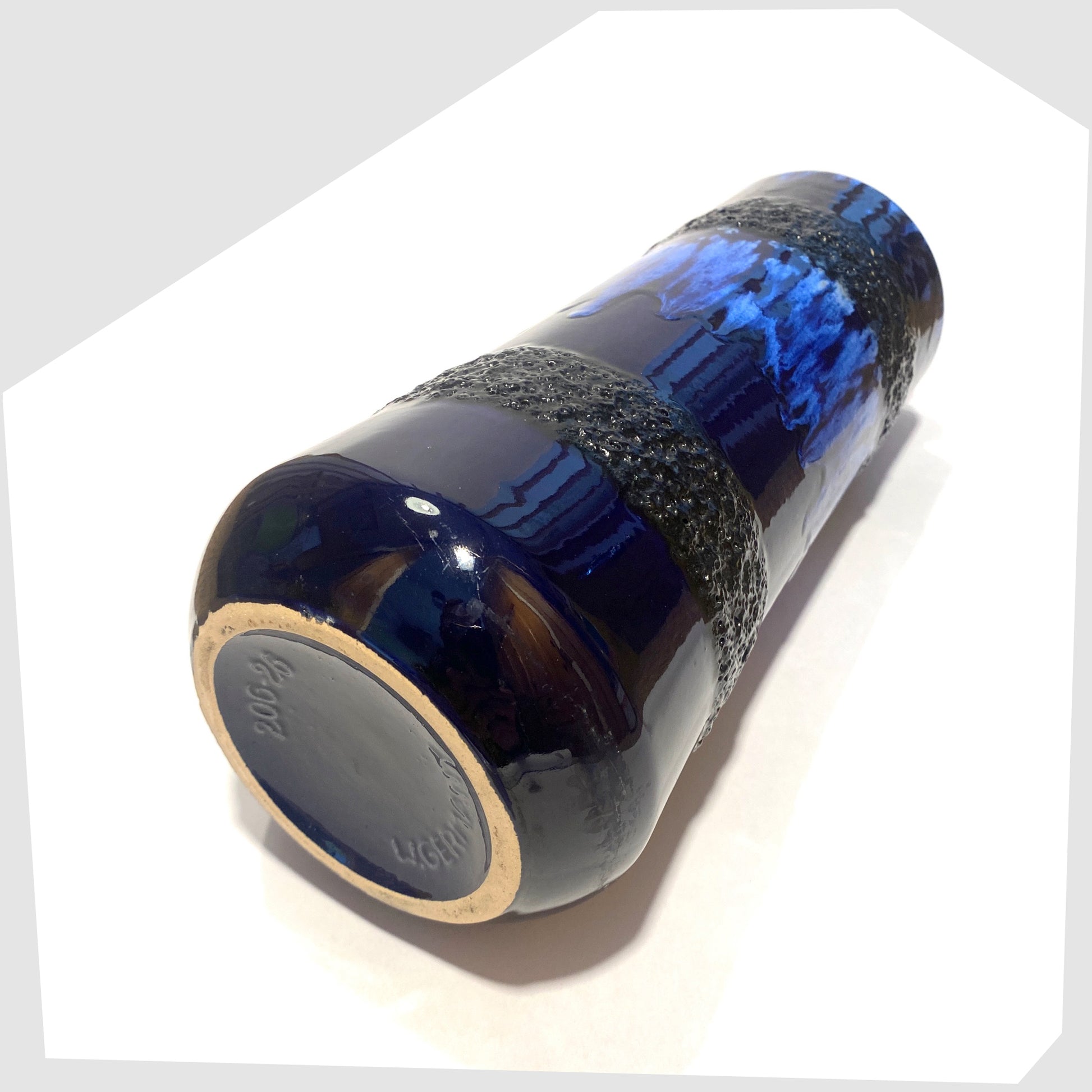 base of the scheurich keramik 206-26 vase, finished in a rich blue glaze with black fat lava bands