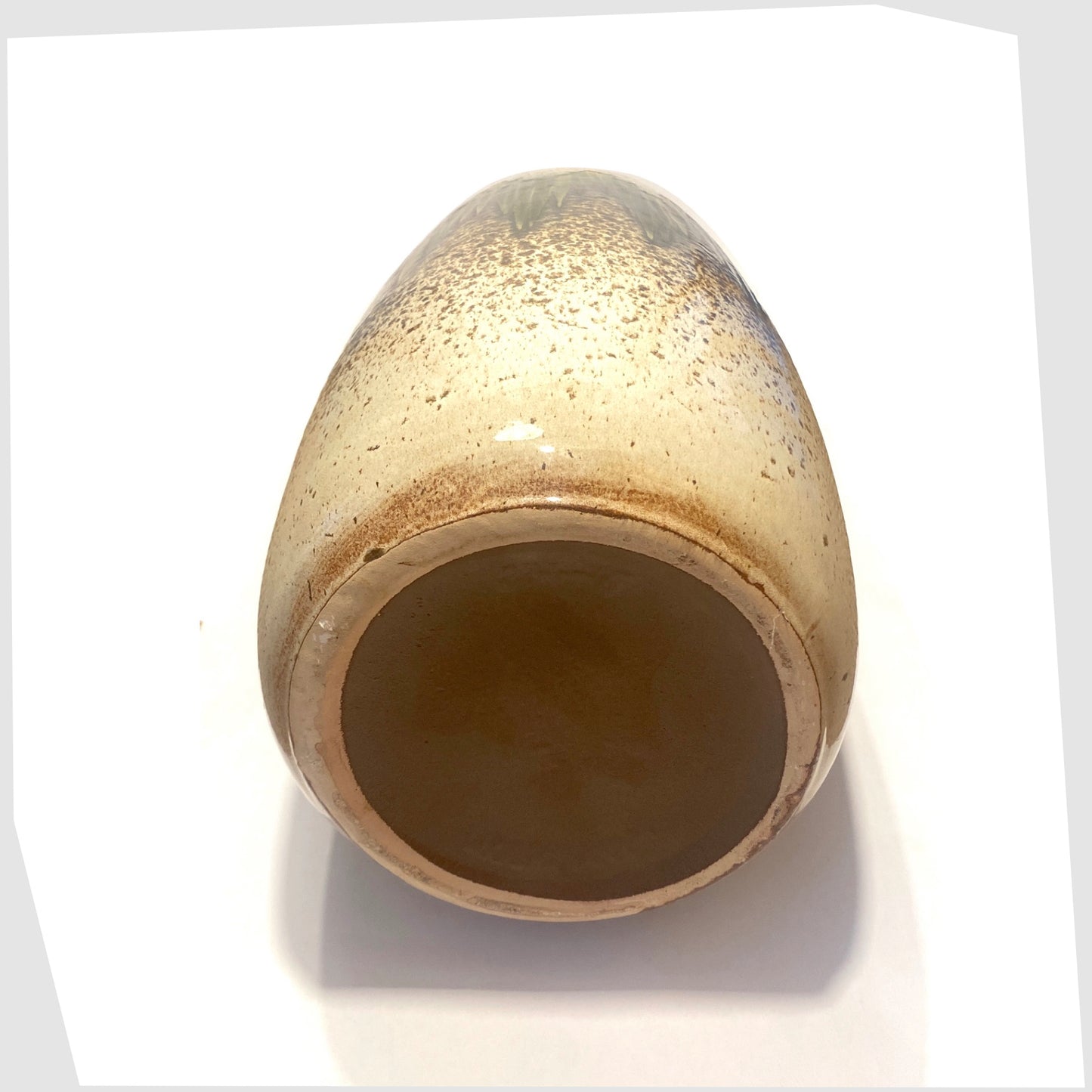 base of the scheurich keramik 284-47 floor vase finished in a speckled beige with central band of green lora glaze