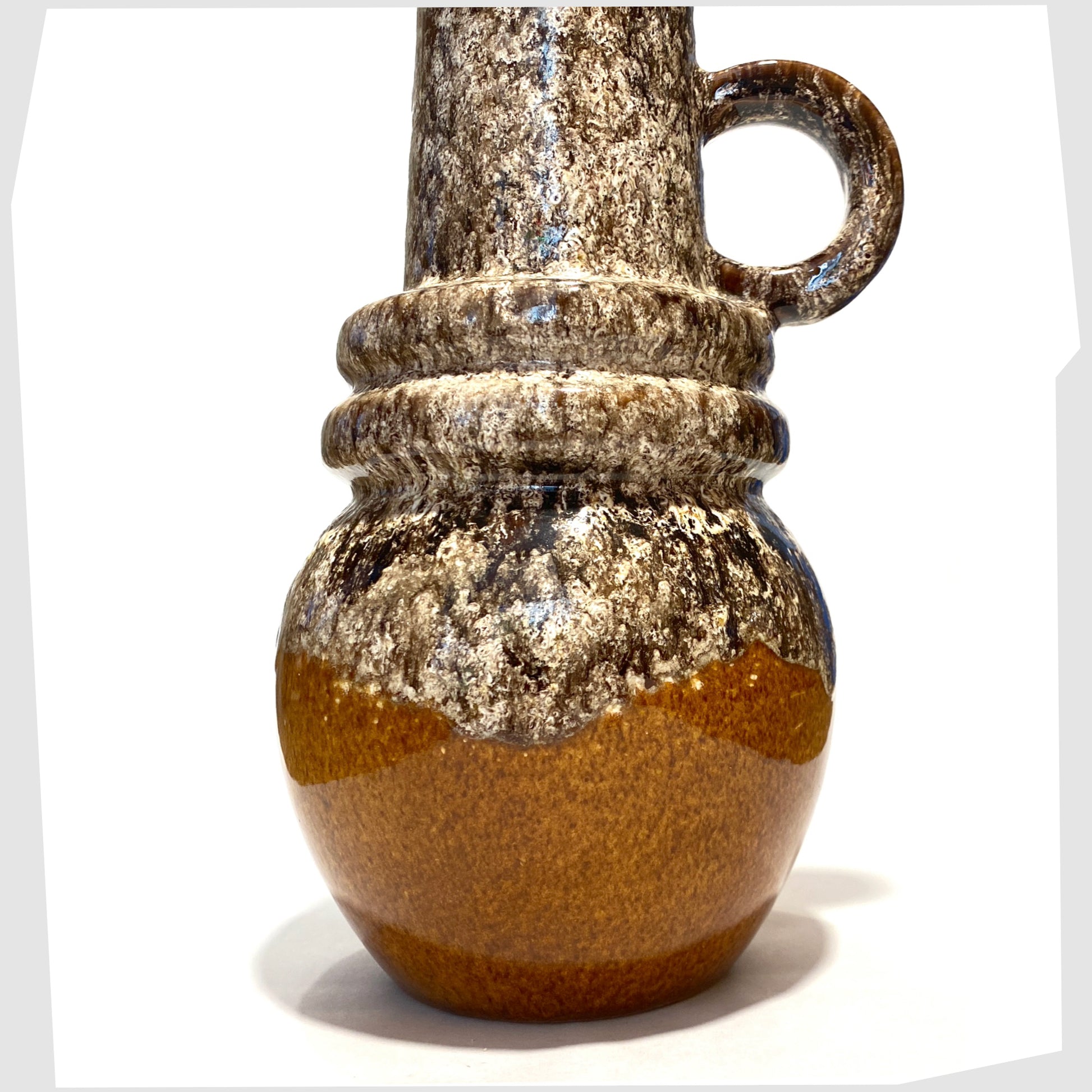 base of the scheurich keramik 428-26 vase with amber glazed base topped with flowing fat lava
